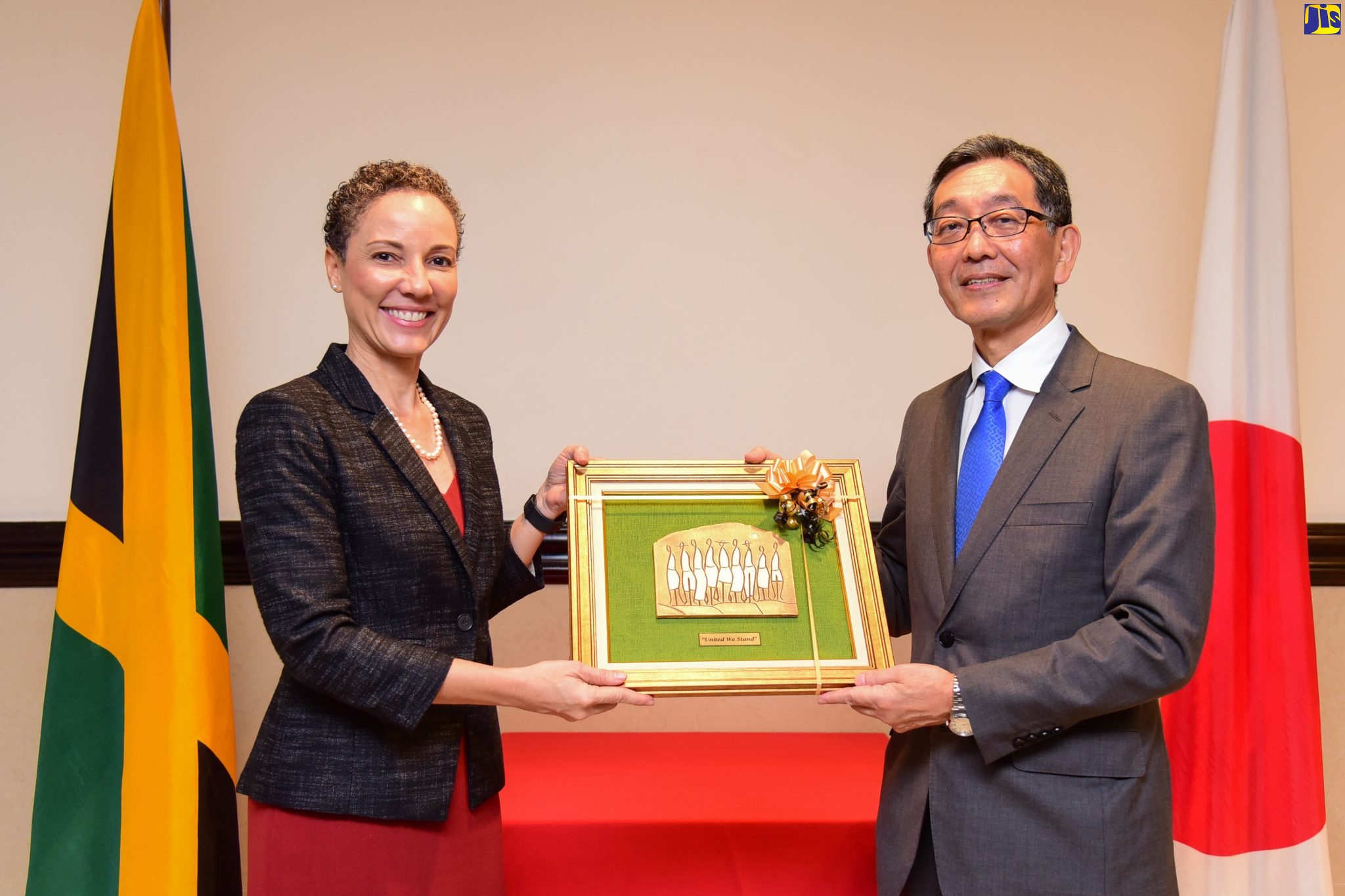 Minister of Foreign Affairs and Foreign Trade, Senator the Hon. Kamina Johnson Smith (left), presents a gift to outgoing Ambassador of Japan to Jamaica, His Excellency Masaya Fujiwara, during a farewell luncheon hosted at The Jamaica Pegasus hotel in New Kingston on November 30.