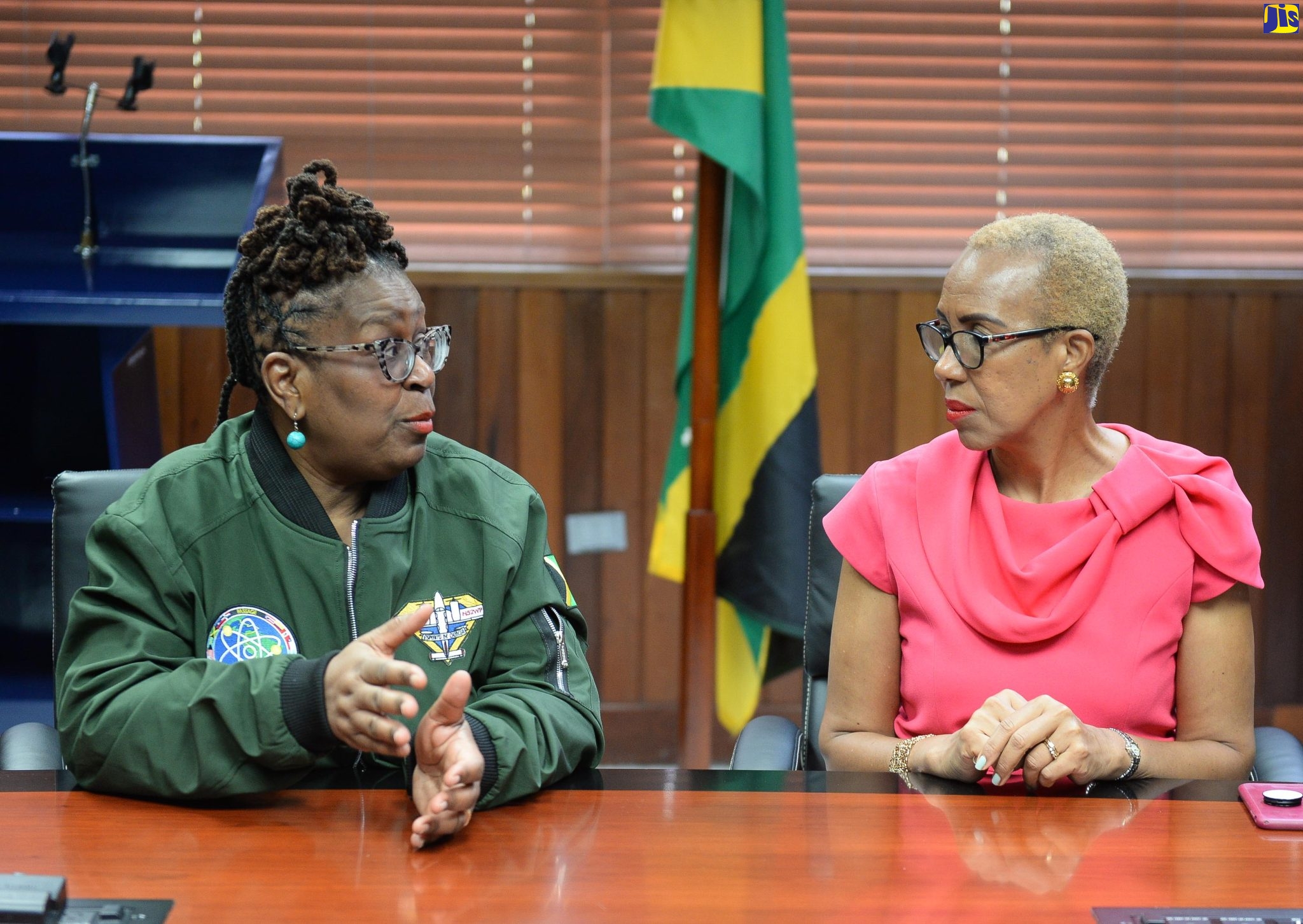 Minister of Education and Youth, Hon. Fayval Williams (right), speaks with Founder and President of the Institute of Caribbean Studies (ICS) in Washington DC, United States and Spirit of Science Mission to Jamaica, Dr. Claire Spence, during a courtesy call at the Ministry in Kingston on December 6. 