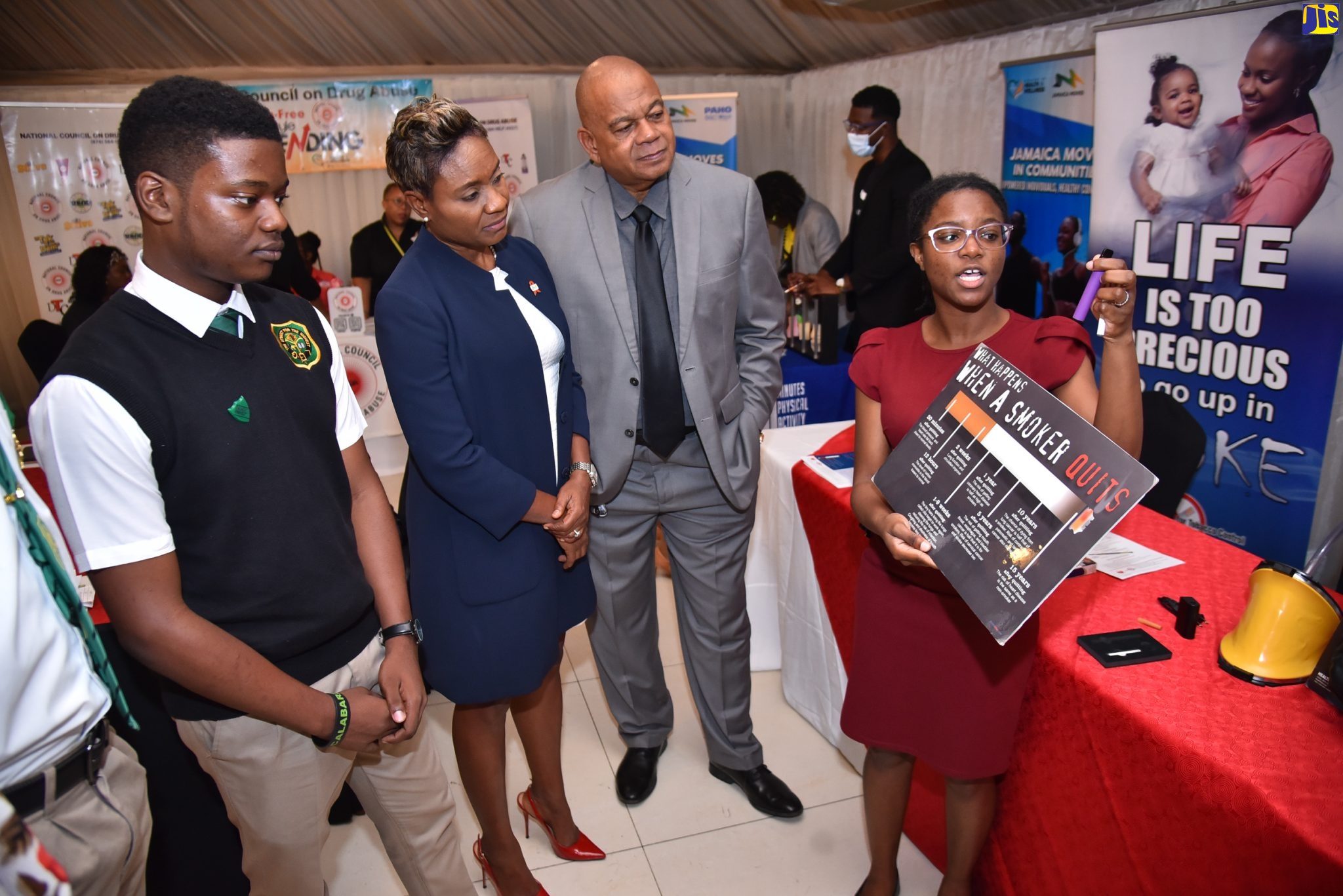Minister of State in the Ministry of Health and Wellness, Hon. Juliet Cuthbert-Flynn (second left), listens as Programmes Officer with the Jamaica Coalition for Tobacco Control, Shanique Brown (right), highlights the dangers associated with vaping among young people, during the National Forum on Youth Drug Use held on Wednesday (November 30), at the Terra Nova All-Suite Hotel in St. Andrew. Also listening are student at Calabar High School, Jon-Marc Webster and Executive Director of the National Council on Drug Abuse (NCDA), Michael Tucker.

