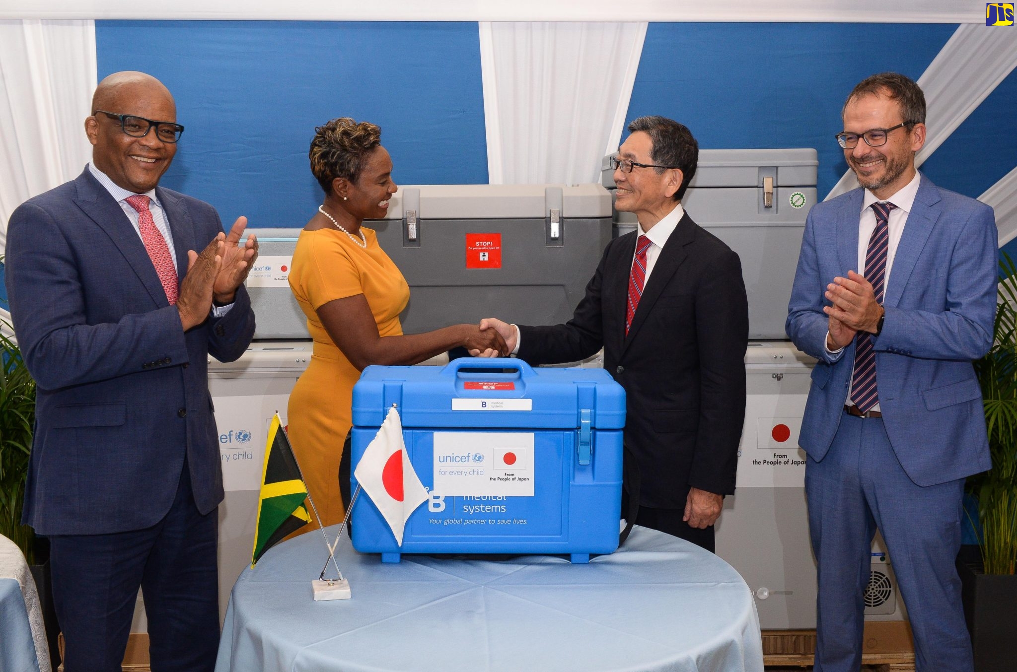 Minister of State in the Ministry of Health and Wellness, Hon. Juliet Cuthbert-Flynn (second left), shakes the hand of Ambassador of Japan to Jamaica, His Excellency Masaya Fujiwara, at the recent handover of medical equipment from the Japanese Government, at the National Chest Hospital in St. Andrew. Applauding (from left) are Minister of State in the Ministry of Foreign Affairs and Foreign Trade, Senator the Hon. Leslie Campbell, and Deputy Representative of the United Nations Children