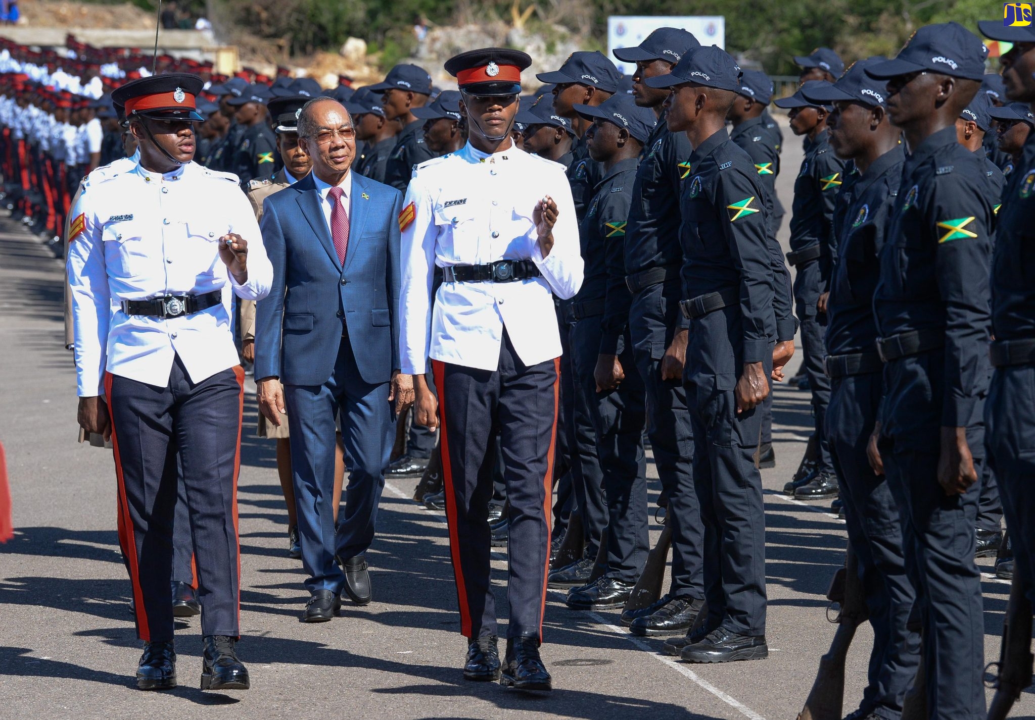 Minister of National Security, Hon. Dr. Horace Chang (centre), inspects new Jamaica Constabulary Force (JCF) constables during the passing out parade and awards ceremony for the 323 recruits at the National Police College of Jamaica (NPCJ) in Twickenham Park, St. Catherine, on Wednesday (November 30). 