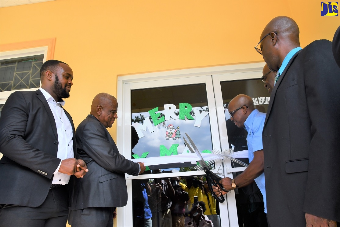 Minister of Agriculture and Fisheries, Hon Pearnel Charles Jr. (third right) cuts the ribbon to officially open the new Rural Agricultural Development Authority (RADA) Office Complex in Lucea, Hanover, on Wednesday (December 14). He is joined by (from left) Parish Board Chairman RADA, Hanover, Lionel Myrie; Minister of State in the Ministry of Agriculture and Fisheries, Hon. Franklin Witter; Mayor of Lucea, Councillor Sheridan Samuels and Acting Chief Executive Officer of RADA, Winston Simpson. 

