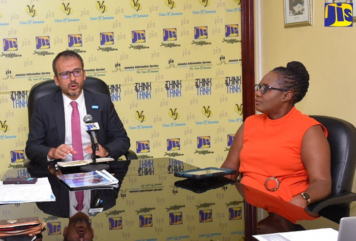 Acting Country Representative, UNICEF Jamaica, Vicente Teran (left), addresses a recent JIS ‘Think Tank’. Listening is Executive Director of the Jamaica Council for Persons with Disabilities (JCPD), Dr. Christine Hendricks.