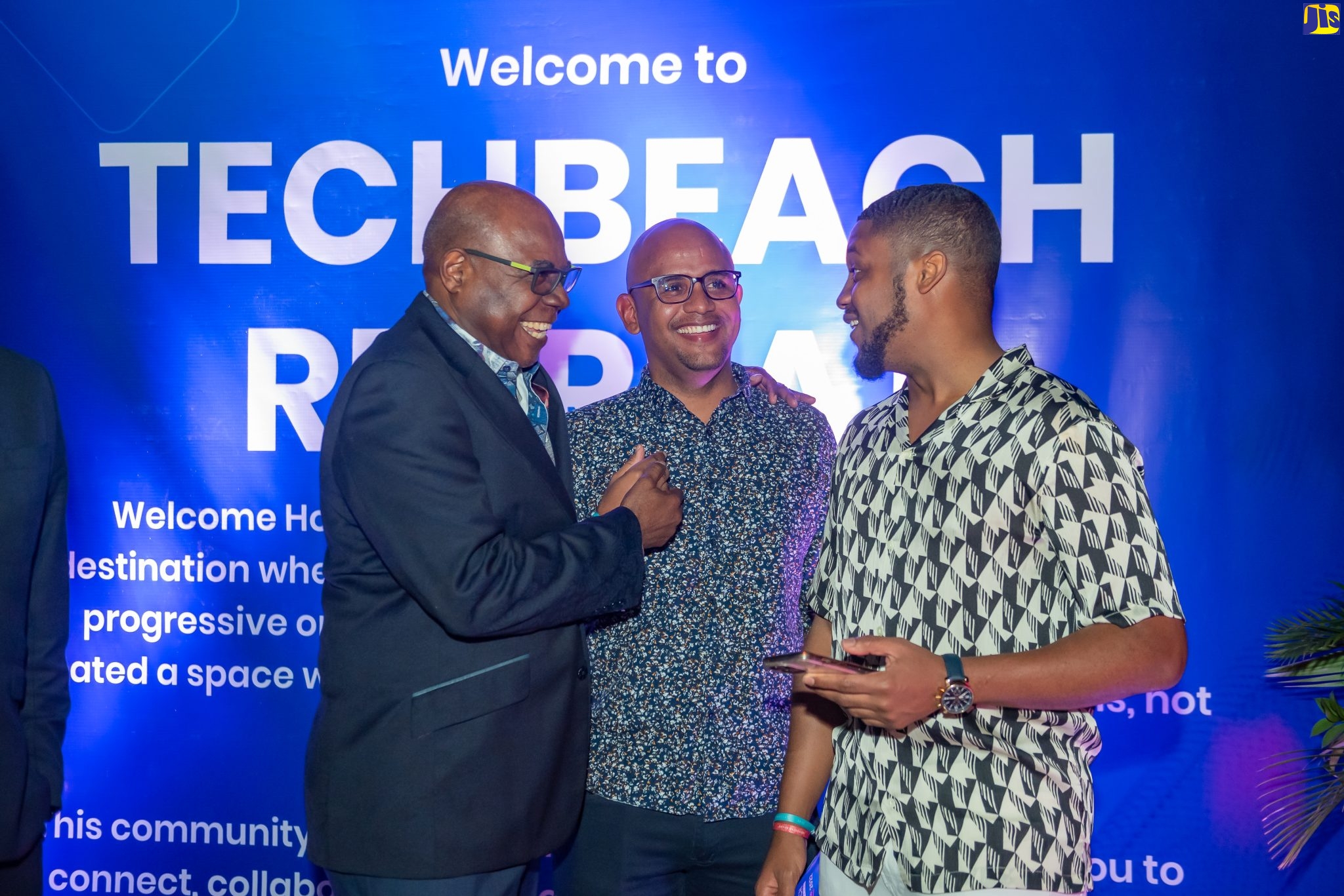 Minister of Tourism, Hon. Edmund Bartlett (left), exchanges pleasantries with Co-founders of Tech Beach, Kirk-Anthony Hamilton (centre) and Kyle Maloney, at the Iberostar Resort in Lilliput St. James, on December 8.
