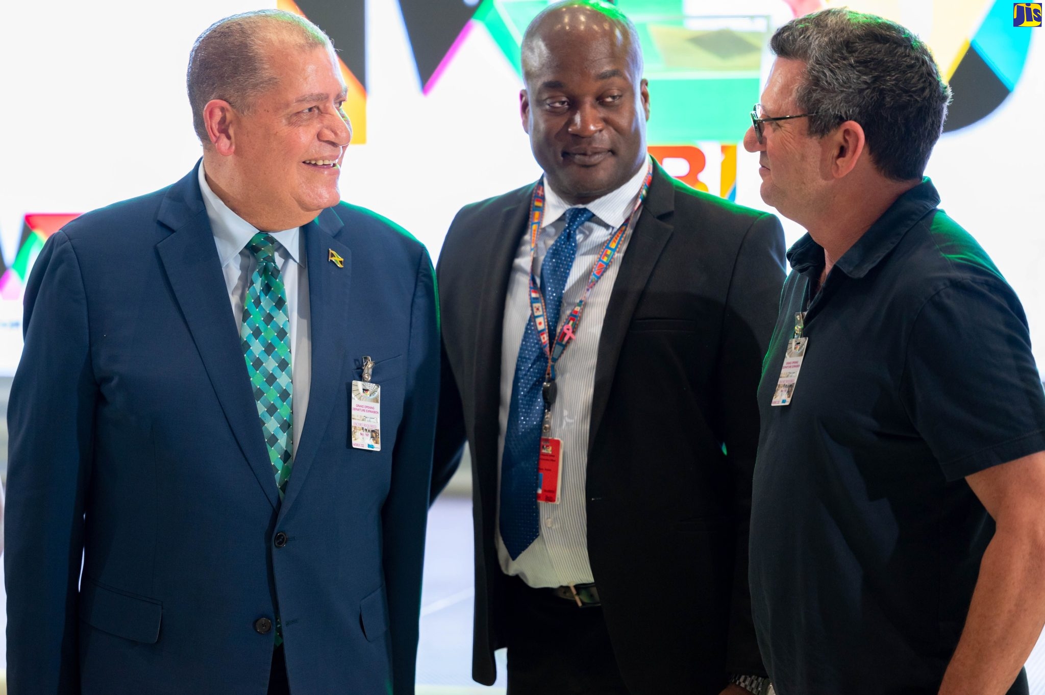 Minister of Transport and Mining, Hon. Audley Shaw (left), is in light-hearted conversation with Chief Executive Officer (CEO) of MBJ Airports Limited, Shane Munroe (centre) and Executive Chairman of Caribbean Producers Jamaica Limited (CPJ) Mark Hart, at the opening of the new Departures Retail Area at the Sangster International Airport, Montego Bay, St. James, on December 14.