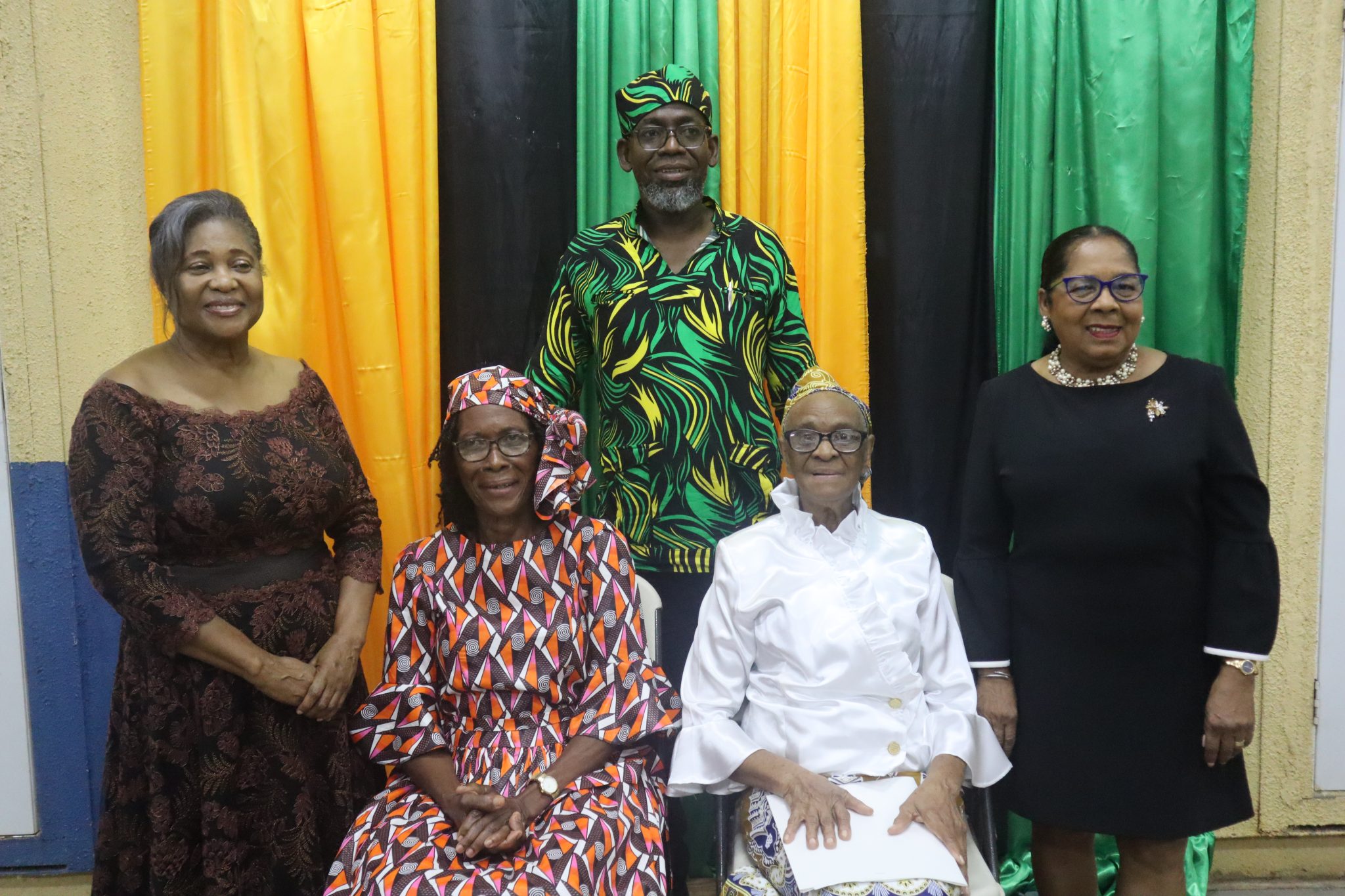 Wife of the Governor-General, Her Excellency the Most Hon. Lady Allen (left), with Retired Educators from the Kitson Town community in St. Catherine (seated, from left), Beverley Robinson and Yvonne Francis, who were recognised for more than 60 years of service by the Kitson Town Civic Committee, during an awards ceremony held in the community recently. Also sharing the moment are  Founder and Chairman of the Committee, Garfield Angus and Custos of St. Catherine, Hon. Icylin Golding. 