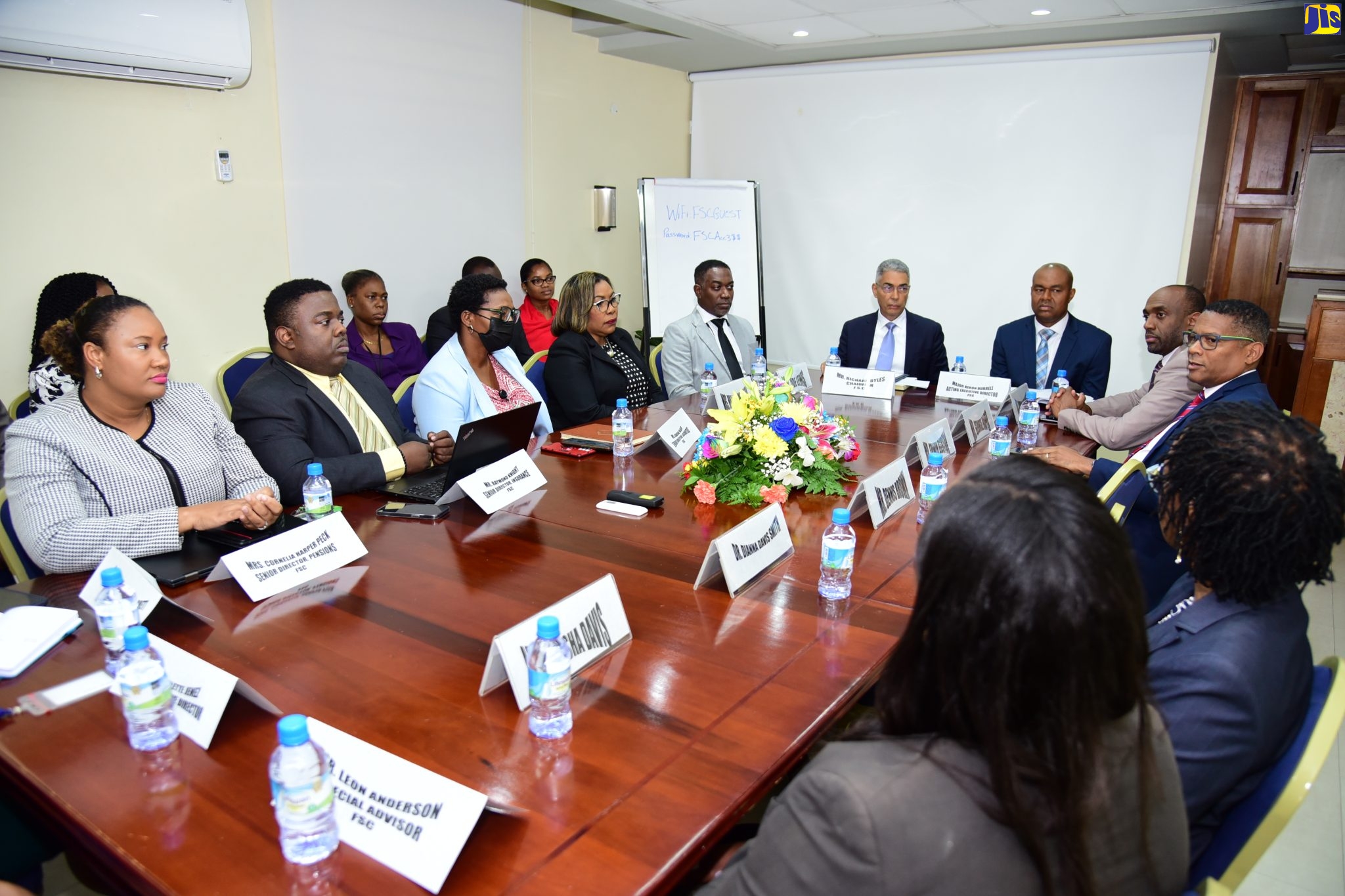 Chairman of the Financial Services Commission (FSC), Richard Byles (left, head of table) convenes a meeting of the FSC board and Executive Director-designate, Major Keron Burrell (right, head of table), with managers of the FSC, at the entity’s New Kingston offices on Thursday (January 26).  Mr. Byles was appointed to chair the FSC’s new eight-member board effective January 23. The new Board’s responsibilities include overseeing the current interventions at Stocks and Securities Limited (SSL), including formalising Mr. Burrell’s appointment, establishing a mechanism to review the FSC’s approach to the SSL case to identify any gaps or constraints, and assessing the status of other licensees and determining whether there are concerns or potential concerns in respect of companies in the securities industry.