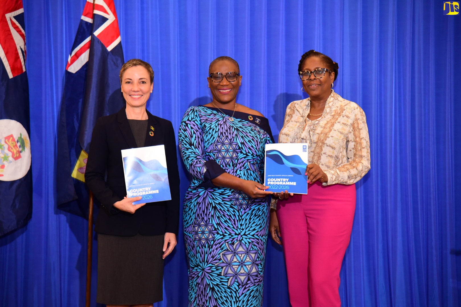 Minister of Foreign Affairs and Foreign Trade, Senator the Hon. Kamina Johnson Smith (left), along with Resident Representative, United Nations Development Programme (UNDP), Denise Antonio and Deputy Leader of Opposition Business in the House of Representatives, Angela Brown-Burke, display copies of the 2022-2026 UNDP Multi-Country Office (MCO) Country Programme document, during the launch at the AC Hotel by Marriott in Kingston on Thursday (January 26).
