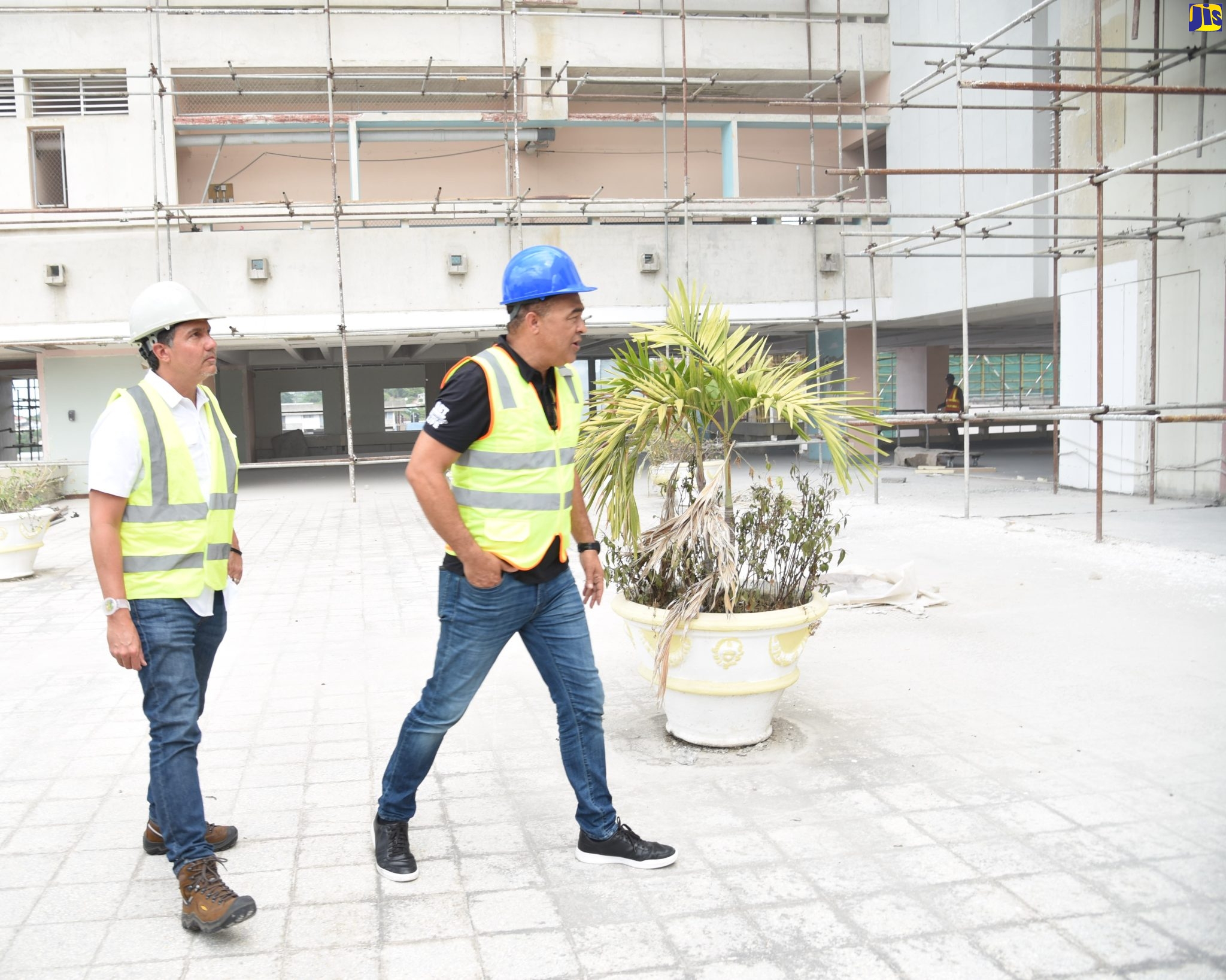 Minister of Health and Wellness, Dr. the Hon. Christopher Tufton (right), and Project Manager for the Cornwall Regional Hospital’s (CRH) rehabilitation, Vivian Gordon, tour a section of the facility on Friday (January 6).