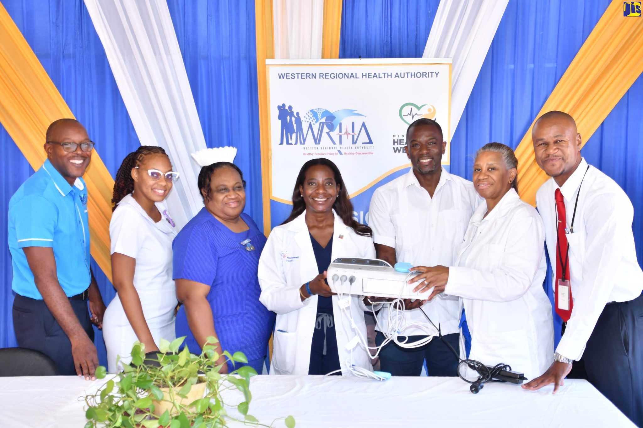 Vice President of Public Health Advocacy at US-based Northwell Health, Dr. Sandra Lindsay (centre), hands over a Cardiotocograph (CTG) to the staff at the Noel Holmes Hospital in Lucea, Hanover, on Friday, January 20. From left are CEO of the Noel Holmes Hospital, Carlington McLennon; Registered Midwife, Arielle England-Reid; Acting Director of Nursing Services, Gracia Davis-Brown; Senior Medical Officer at Noel Holmes Hospital, Patrice Monthrope; Associate Chief of Labour and Delivery at Northwell Health, Dr. Monique De Four Jones; and Parish Manager of Hanover Health Services, Aldwayne Beckford.