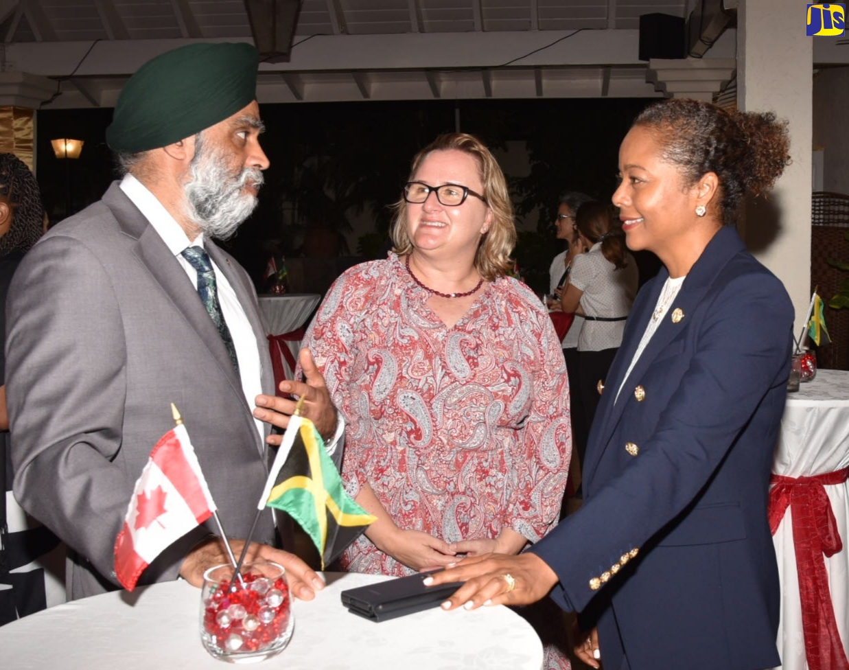 Minister of Legal and Constitutional Affairs, Hon. Marlene Malahoo Forte (right), listens as Canada’s Minister of International Development, Hon. Harjit Sajjan (left), makes a point. Occasion was a reception celebrating Jamaica’s Women Parliamentary Caucus, held recently at the official residence of the Canadian High Commission in Kingston. Sharing in the conversation is High Commissioner of Canada in Jamaica, Her Excellency, Emina Tudakovic.