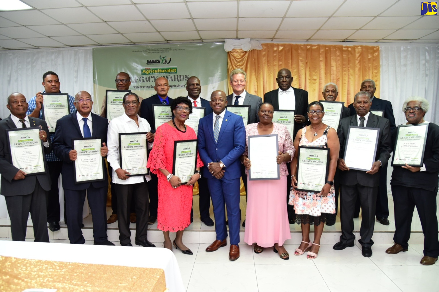 Minister of Agriculture and Fisheries, Hon. Pearnel Charles Jr. (centre, front row) is flanked by recipients of the Agricultural Legacy Awards during the ceremony held on Saturday (January 14) at the Medallion Hall Hotel, Kingston.

