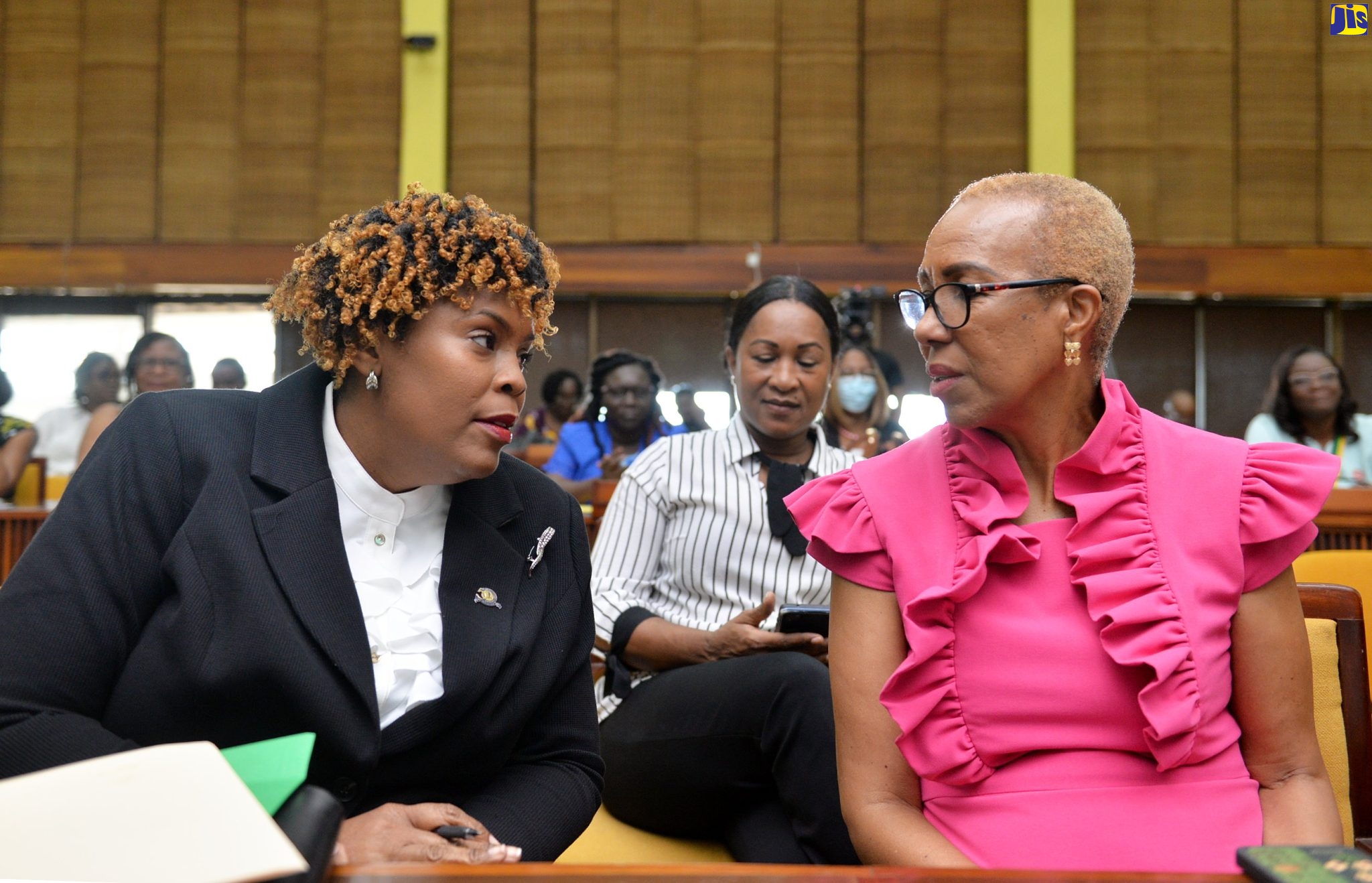 Minister of Education and Youth, Hon. Fayval Williams (right), speaks with President, Jamaica Teachers' Association (JTA), LaSonja Harrison (left) at the Global Education Teacher Summit held at the Jamaica Conference Centre, on January 21. Looking on is Manager, Communication and Public Relations Division in the Ministry of Education and Youth, Sheryl Bromfield.