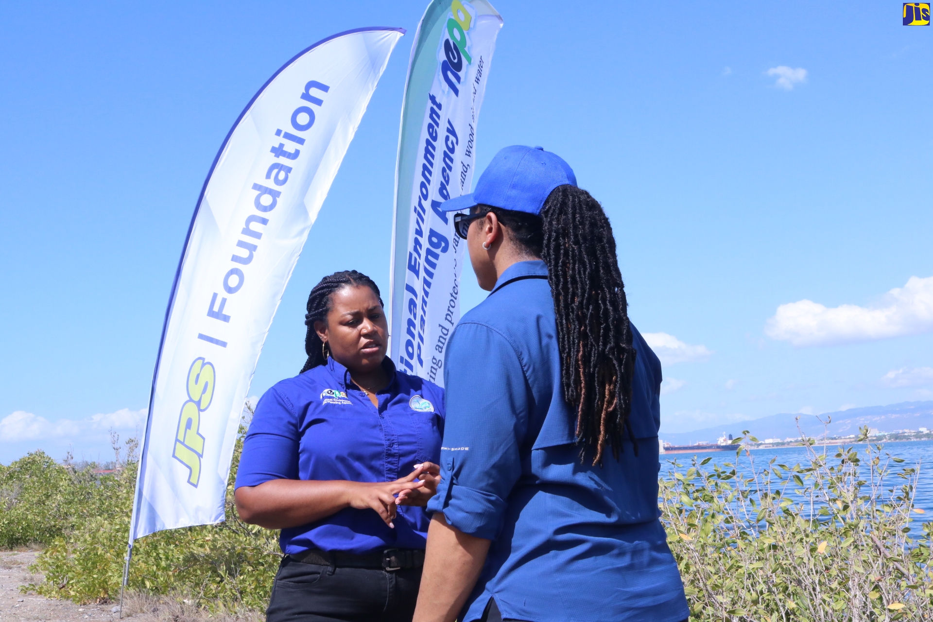 Acting Ecosystems Coordinator, Ecosystems Management Branch, National Environment and Planning Agency (NEPA), Chanel Raynor (left), speaking with Manager of Ecosystems, NEPA, Monique Curtis, during the launch of the entity’s Adopt-A-Mangrove programme at Sturridge Park in the Palisadoes-Port Royal Protected Area (PRPA) in Kingston, on Thursday (February 2).