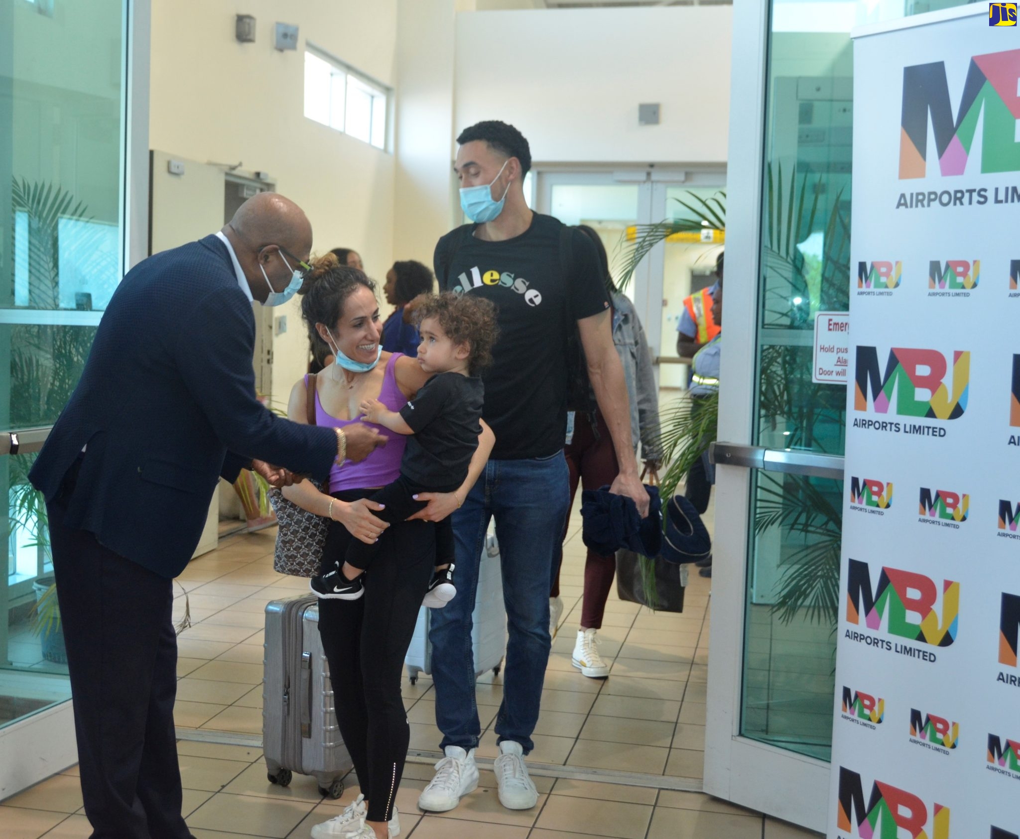 Minister of Tourism, Hon. Edmund Bartlett (left), welcomes passengers on Frontier Airlines’ inaugural nonstop flight from Denver, Colorado, in the United States, which arrives at Sangster International Airport (SIA) in St. James on Friday (February 24).
