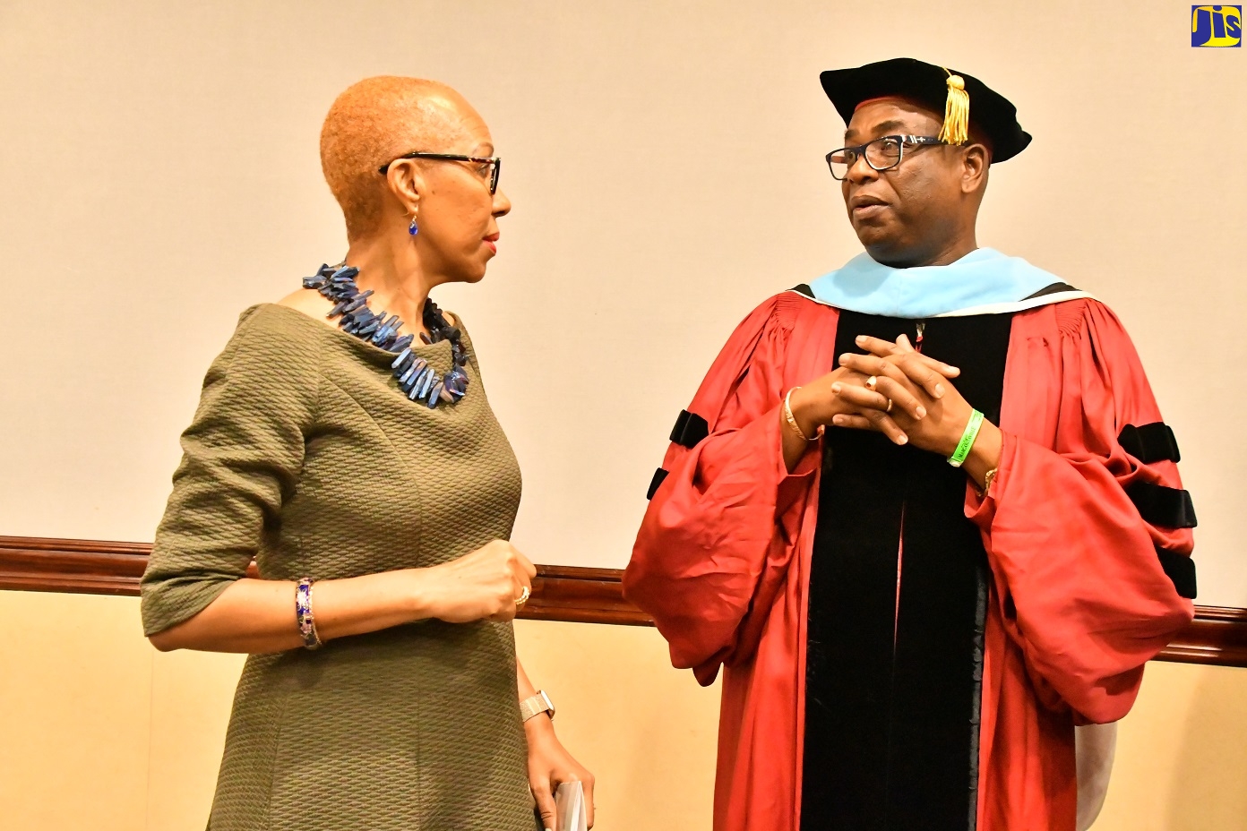 Minister of Education and Youth, Hon Fayval Williams (left), converses with Principal of Church Teachers’ College in Manchester, Dr. Garth Anderson, following the graduation ceremony for Temple University/Church Teachers’ College Master’s student cohort at the Holiday Inn Resort, Rose Hall, St James, on Thursday (February 16).