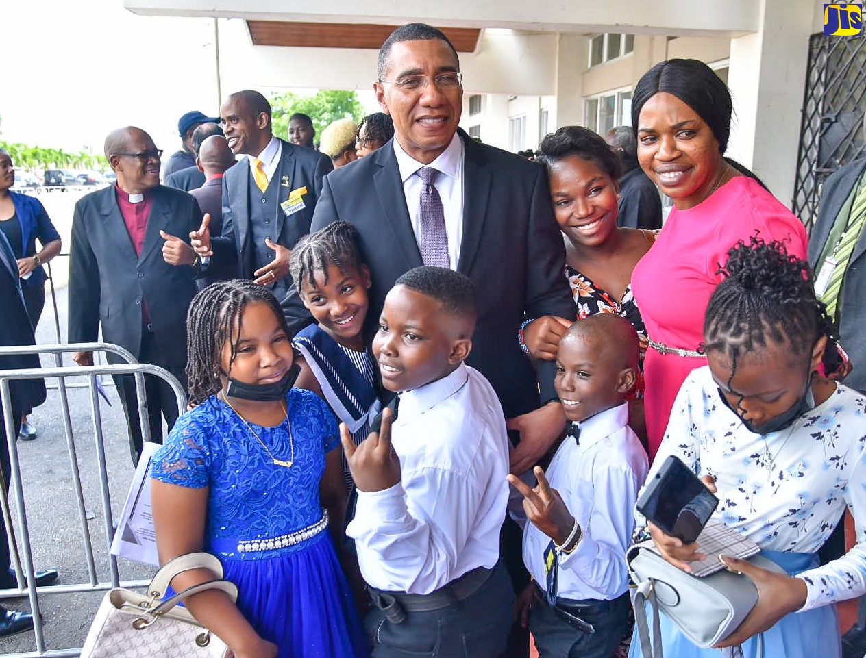 Prime Minister, the Most Hon. Andrew Holness (centre), is greeted by young people at the National Arena in St. Andrew on Sunday (Feb. 26), following his participation in the Jamaica Baptist Union’s (JBU) 173rd General Assembly, held under the theme: ‘Keeping Faith with The Word in an Ever-Changing World – Embracing the Mystery.’ The Prime Minister read the first lesson.