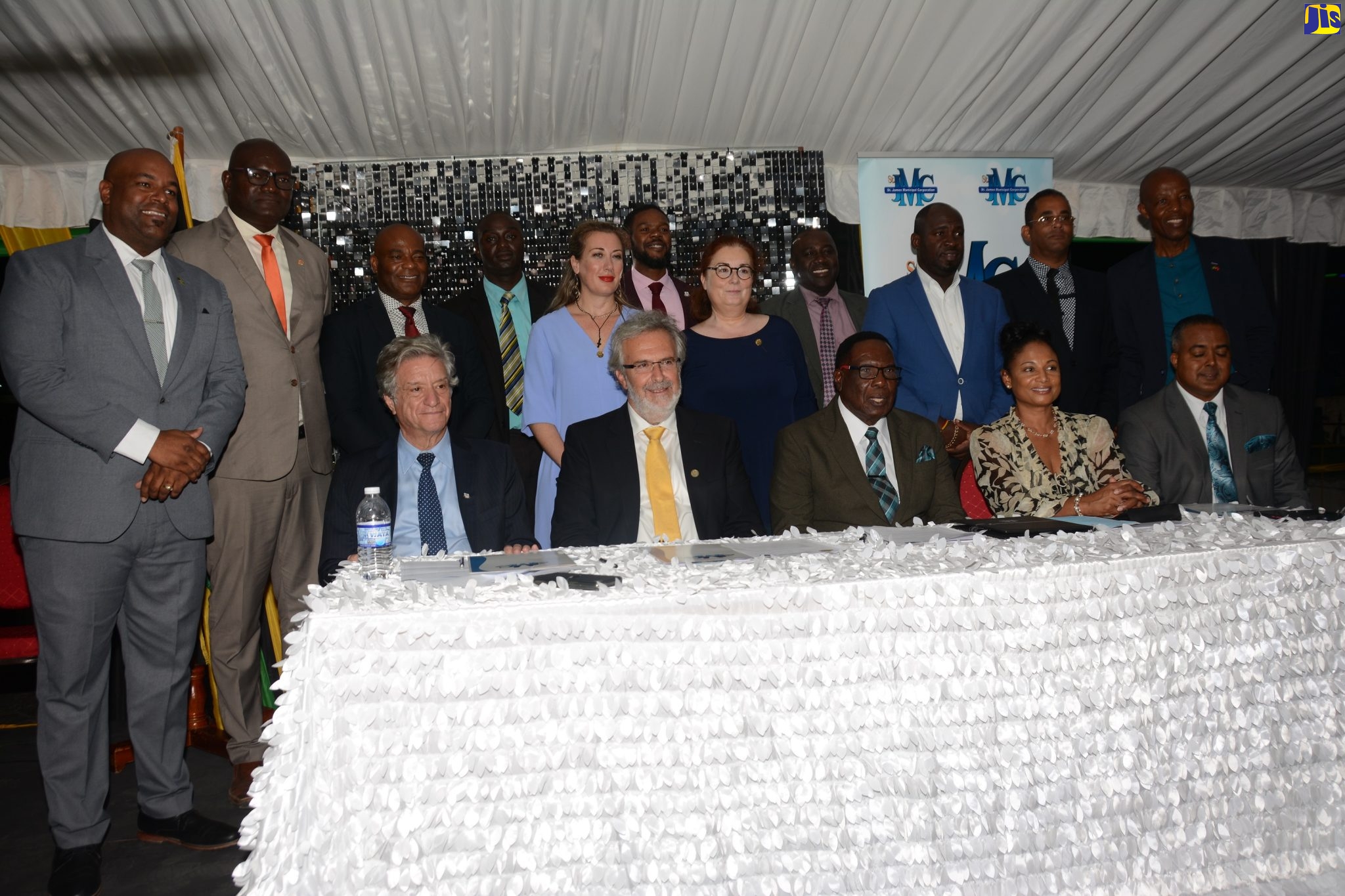 Mayor of Montego Bay and Chairman of the St. James Municipal Corporation, Councillor Leeroy Williams (seated, centre); Mayor of the Municipality of Sitia, Crete in Greece, Georgios Zervakis (seated, second left); and Regional Director at the Jamaica Tourist Board (JTB), Odette Soberam-Dyer (seated, second right), are joined by Councillors of the Corporation and a delegation from Sitia, at the official signing  of a Memorandum of Understanding (MOU) to formally twin the sister cities, at Sam Sharpe Square in Montego Bay, St. James, on Thursday (February 16).
