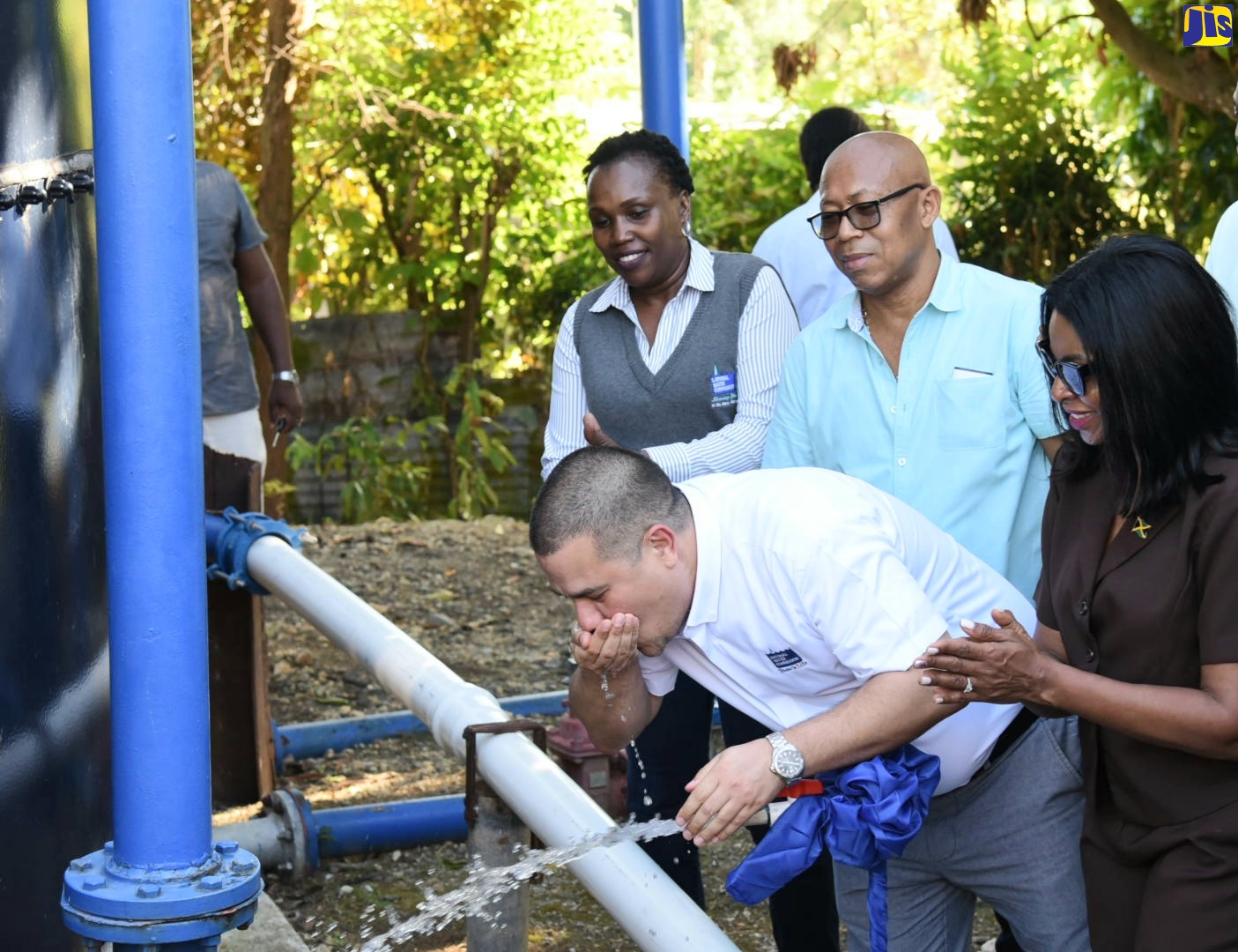 Minister without Portfolio in the Ministry of Economic Growth and Job Creation, Senator the Hon. Matthew Samuda (second right), enjoys a sip of water from the newly commissioned Fraser Hill Storage Tank Replacement Project in St. Thomas, on February 8. Sharing the moment (from left) are Regional Manager for Kingston, St. Andrew and St. Thomas at the NWC, Dr. Phillipa Campbell-Francis; former Mayor of Morant Bay, Councillor Michael Hue and Member of Parliament for St. Thomas Eastern, Dr. Michelle Charles.