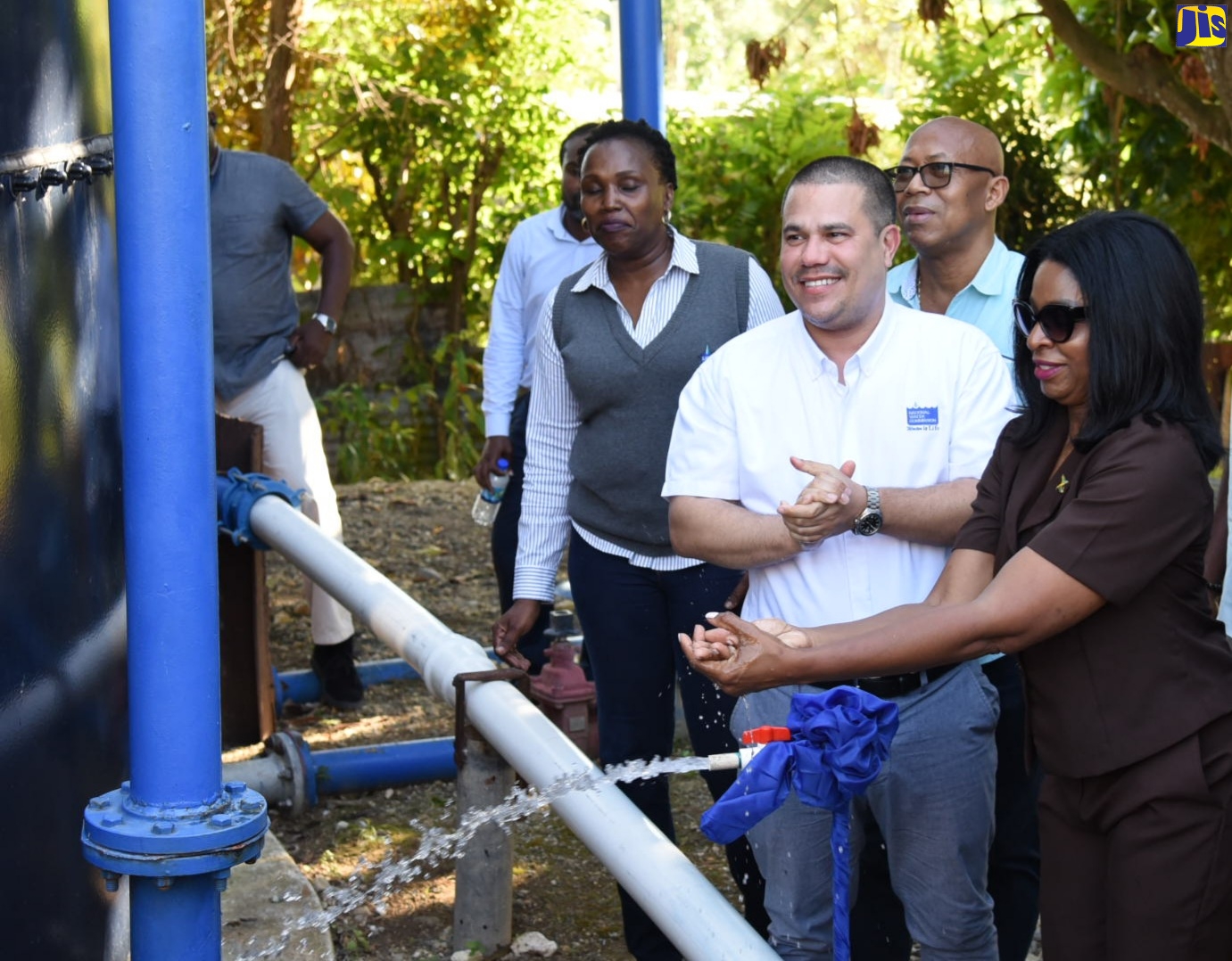 Minister without Portfolio in the Ministry of Economic Growth and Job Creation, Senator the Hon. Matthew Samuda (second right), smiles brightly during the commissioning of the Fraser Hill Storage Tank Replacement Project in St. Thomas on February 8. Joining him are (from left) Regional Manager for Kingston, St. Andrew and St. Thomas at the NWC, Dr. Phillipa Campbell-Francis; former Mayor of Morant Bay, Councillor Michael Hue and Member of Parliament for St. Thomas Eastern, Dr. Michelle Charles.