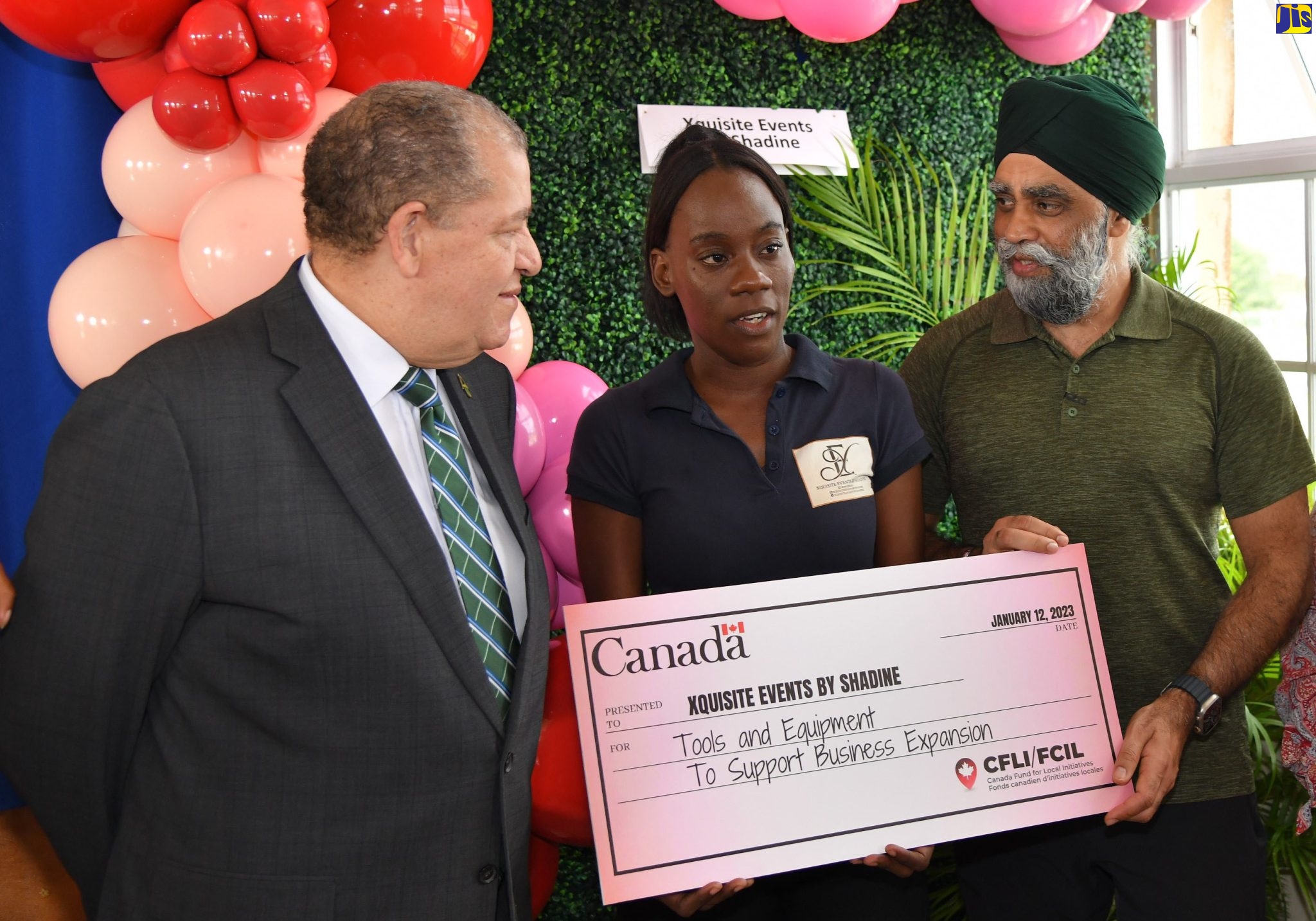 Member of Parliament for Manchester North Eastern, Hon Audley Shaw (left), looks on as Canada