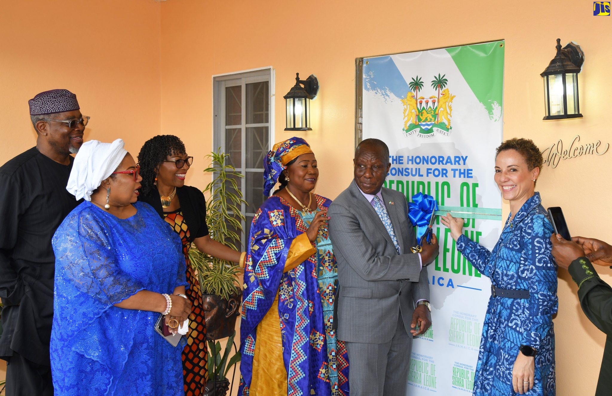 Minister of Foreign Affairs and Foreign Trade, Senator the Hon. Kamina Johnson Smith (right); and High Commissioner of the Republic of Sierra Leone to Jamaica and Ambassador to the United States of America, His Excellency Sidique Abou-Bakarr Wai (second right), cut the ribbon to officially open the Honorary Consulate of the Republic of Sierra Leone, in Red Hills, on February  7.  Sharing the moment (from left) are Immediate Past Chairman of the Nigerian Stock Exchange, Bimbo Ogunbanjo; Nigeria’s High Commissioner to Jamaica, Belize, Haiti and the Dominican Republic, Dr. Maureen Tamuno; Honorary Consul for the Republic of Sierra Leone to Jamaica, Professor Rosalee Hamilton; and Minister of Tourism and Cultural Affairs, Sierra Leone, Hon. Dr. Memunatu Pratt.