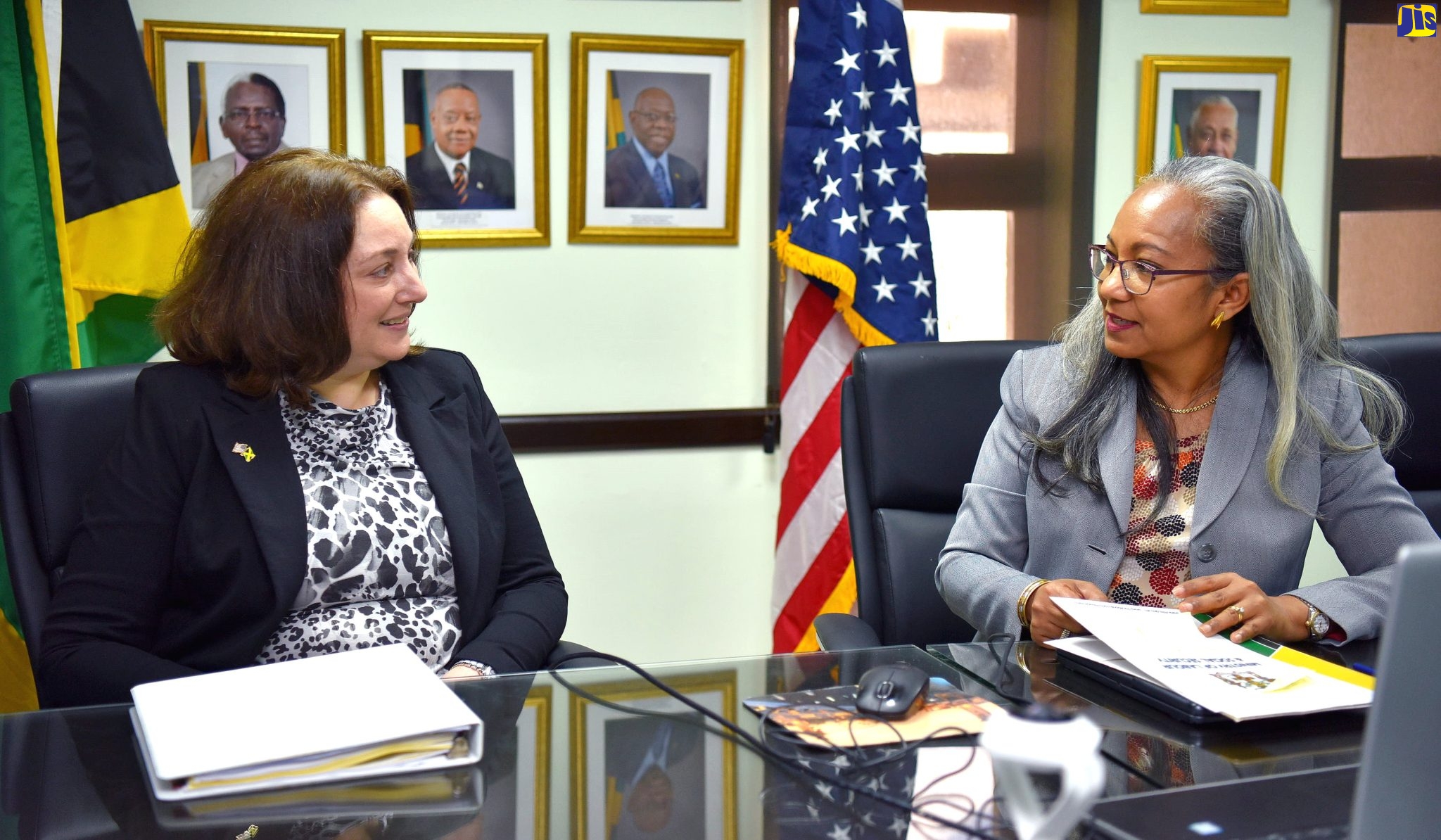 Permanent Secretary in the Ministry of Labour and Social Security, Collette Roberts Risden (right) shares in discussion with Deputy Assistant Secretary for Visa Services, United States Embassy, Julie M. Stufft, during a courtesy call at the Ministry