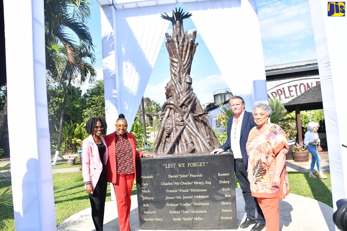 Minister of Culture, Gender, Entertainment and Sport, Hon Olivia Grange (second left), stands with (from left) Glenmuir High School teacher, Trishaunna Henry; Managing Director, J Wray and Nephew (JWN), Jean-Phillipe Beyer, and JWN Master Blender, Joy Spence, at the “Lest We Forget’ monument, which was unveiled at the Joy Spence Appleton Estate Rum Experience in St. Elizabeth on Monday (February 27).