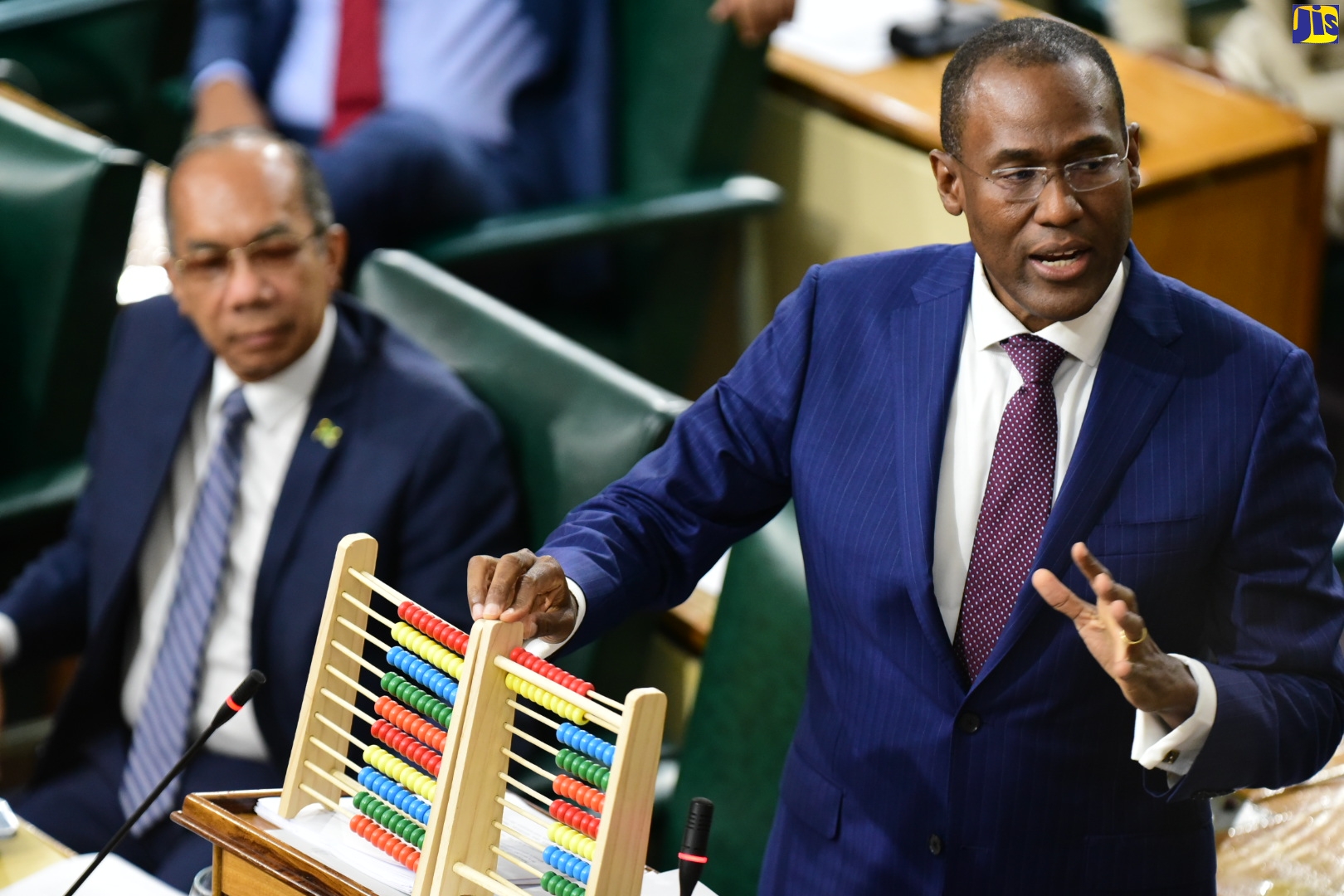 Minister of Finance and the Public Service,  Dr. the Hon. Nigel Clarke, opens the 2023/24 Budget Debate in the House of Representatives, on Tuesday (March 7). Seated is Deputy Prime Minister and Minister of National Security, Hon. Dr. Horace Chang.