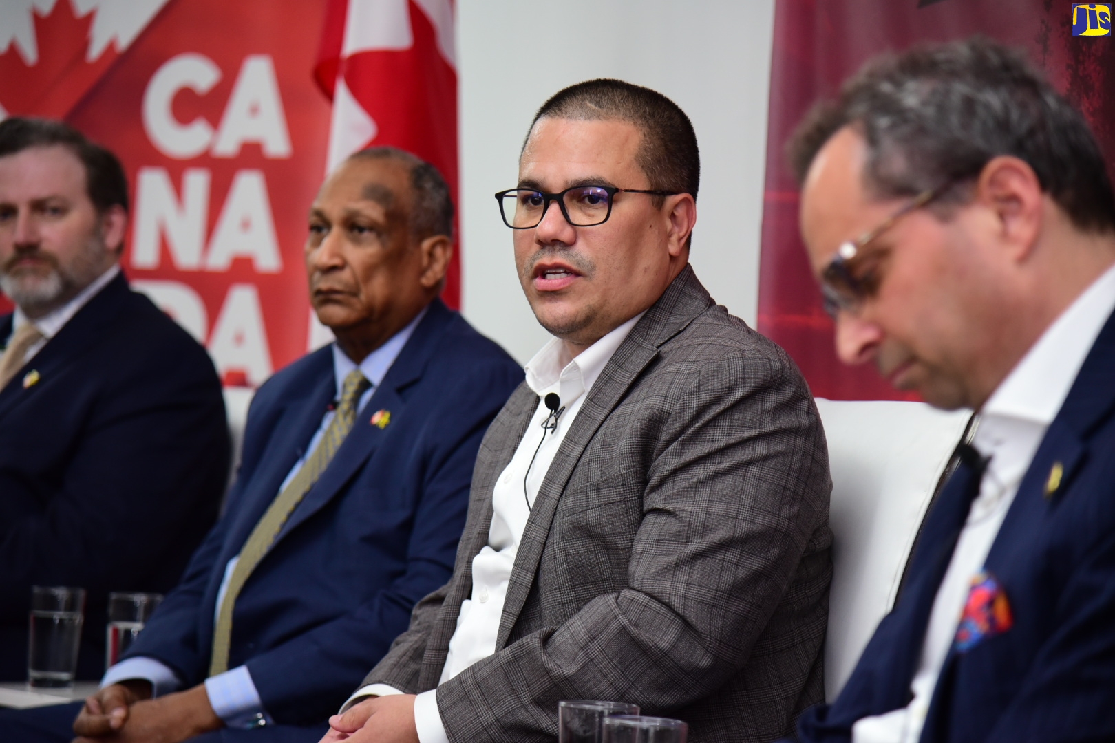 Minister without Portfolio in the Ministry of Economic Growth and Job Creation, Senator the Hon. Matthew Samuda (second right), addresses the High Commission of Canada in Jamaica’s Policy and Regulatory Masterclass – The Climate Approach,  held at the Spanish Court Hotel in Kingston, on March 30. Others (from left) are President and Chief Executive Officer, Energy Council of Canada, Jacob Irving; Chair, Energy Council of Canada, Howard Shearer and Partner, Gowling WLG (Toronto), Ian Mondrow.