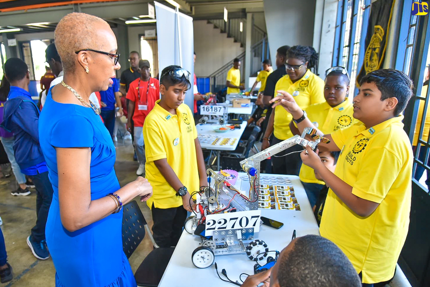 Minister of Education and Youth, Hon. Fayval Williams (left), speaks with members of the St. Ann-based York Castle High School team about their entry in the National Robotics Championship, during the competition on Saturday (February 25), at Jamaica College in St. Andrew. They are (from left) Rishi Pahilajani, coach; Robina Reid; Shemar McGrath, and Nikhil Lalwani.