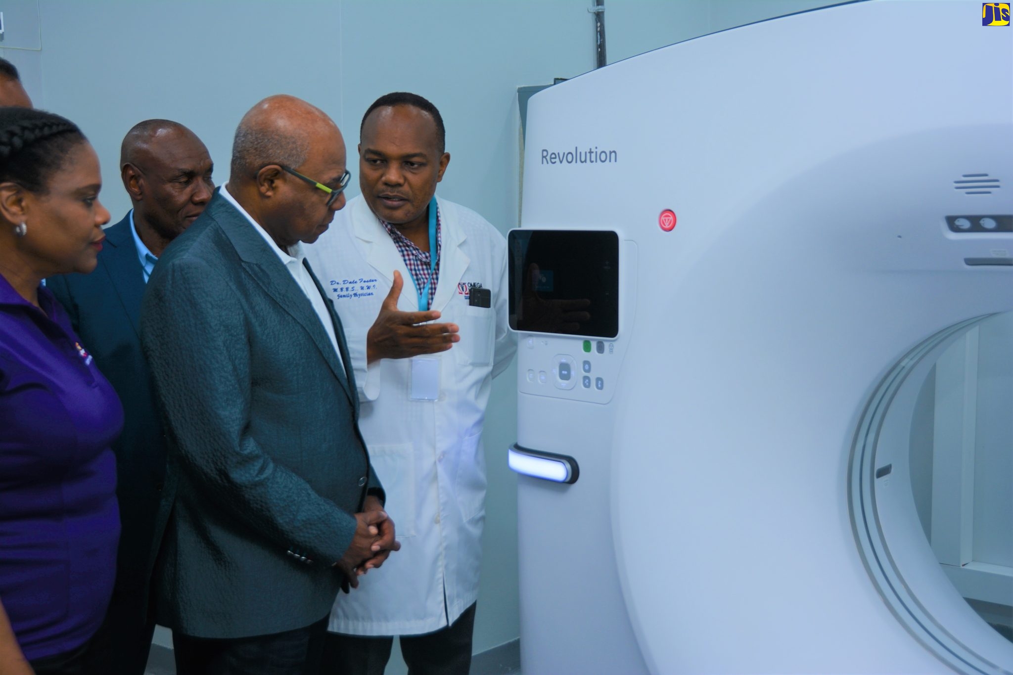 Minister of Tourism, Hon. Edmund Bartlett (second right), looks on as Director and owner of Omega Medical Hospital in Negril, Dr. Dale Foster (right), explains the use of a computerized tomography (CT) scan, during a visit on Friday (March 24). Looking on (from left) are Permanent Secretary in the Ministry of Tourism, Jennifer Griffith and Chief Executive Officer of Omega Medical Hospital, Dr. Dolton James.