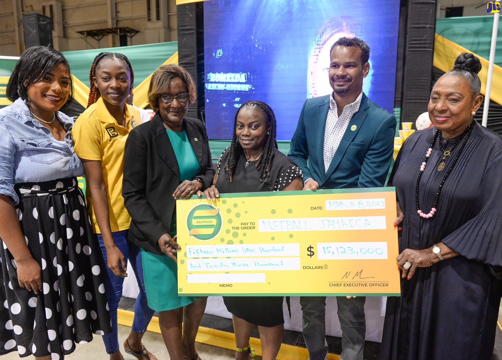 Minister of Culture, Gender, Entertainment and Sport, Hon. Olivia Grange (right), shares in the symbolic cheque handover of $15.1 million by the Seprod Group to Netball Jamaica. Holding the cheque  are: Head of Supply Chain, Seprod, Marilyn Golding-Anderson (third left);  Board President, Netball Jamaica, Tricia Robinson (centre); and Chief Financial Officer, Seprod Group, Damion Dodd. Also sharing in the moment are Business Development Manager, Serge Island Industries, Sheridan Cohen (left); and Captain of the Sunshine Girls Netball Team, Shanice Beckford. Seprod Group will be providing  yearlong sponsorship in support of Jamaica’s Sunshine Girls’ journey to the 2023 Netball World Cup to be held in South Africa. The ceremony was held on Wednesday (March 8), at the National Indoor Sports Centre, Kingston.