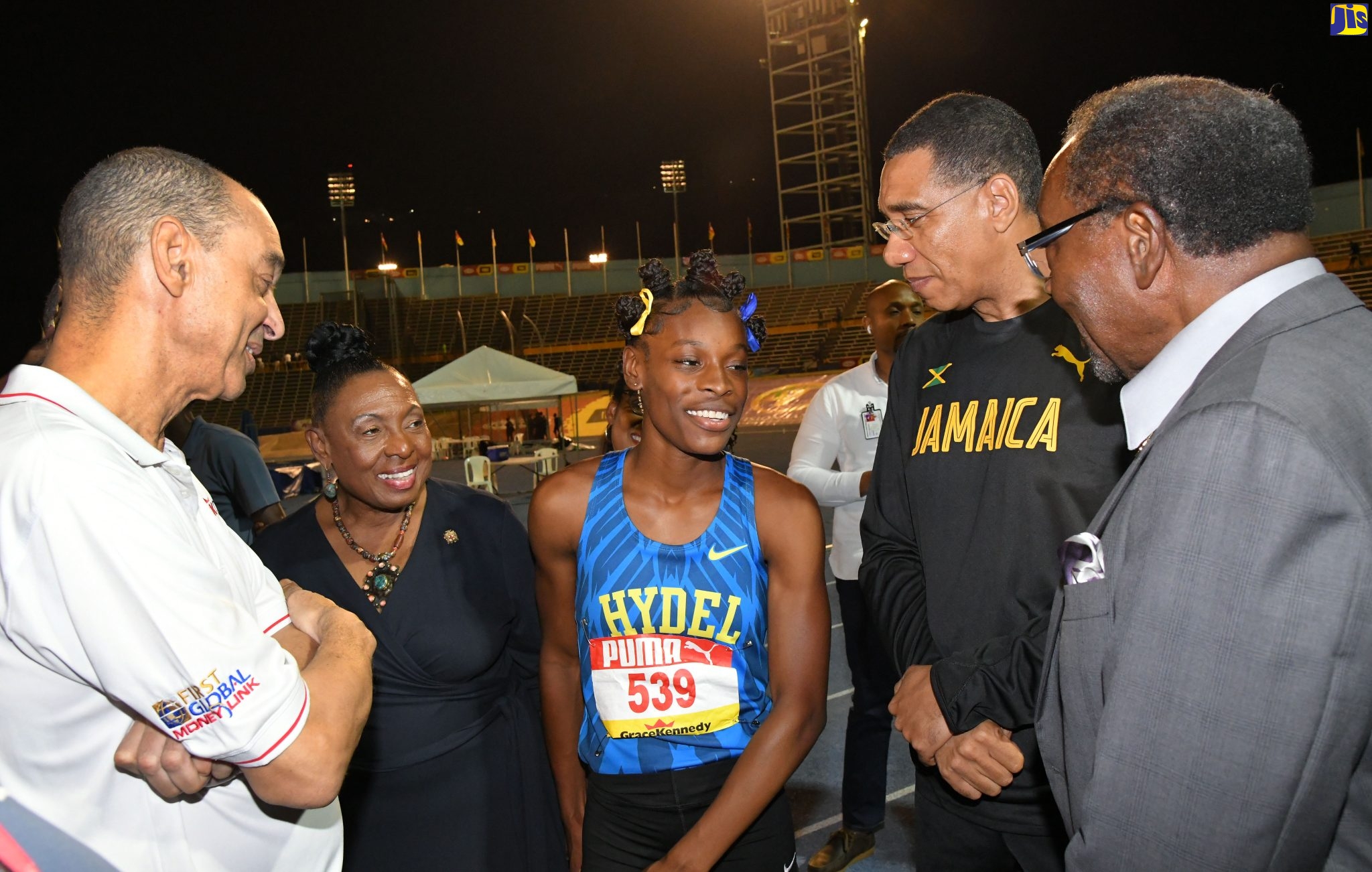 Prime Minister, the Most Hon. Andrew Holness (second right), congratulates Class One, 100-metre champion, Hydel High School’s Alana Reid, (centre) following her record-breaking 10.92 seconds victory in the event, at the Boys and Girls’ Championship (Champs) at the National Stadium on March 29. Sharing the moment (from left) are: Group Chief Executive Officer of GraceKennedy Limited, Senator Don Wehby; Minister of Culture, Gender, Entertainment and Sport, Hon. Olivia Grange; and United States Ambassador to Jamaica, His Excellency Nick Perry.