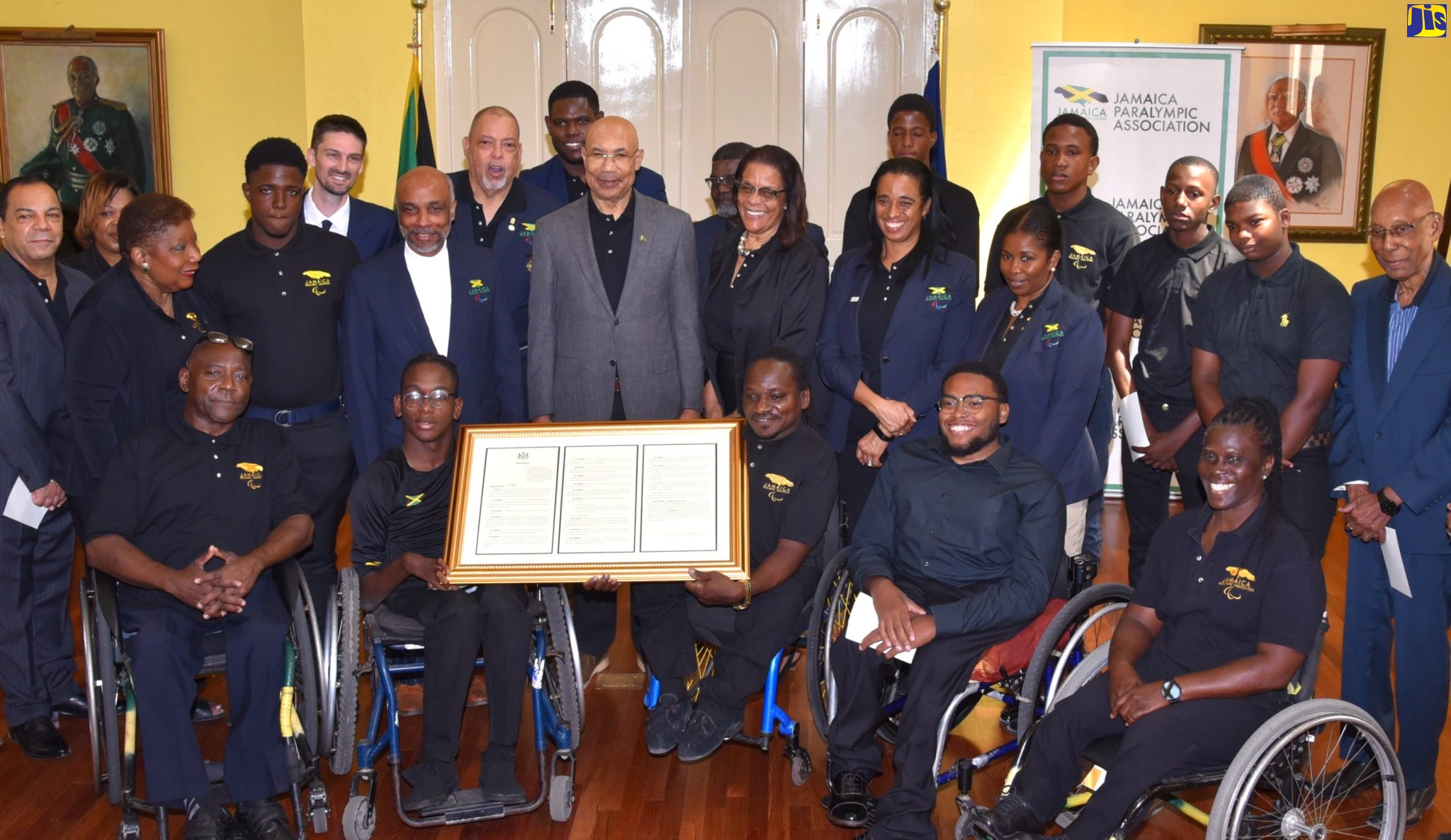 Governor-General, His Excellency the Most Hon. Sir Patrick Allen (fourth right, second row), and Jamaica Paralympic Association (JPA) President, Christopher Samuda (fourth left, second row), with other JPA Board members and representatives of the country’s team in training for the 2023 Paralympic Games. The occasion was the official launch of the JPA’s ‘I’m Phenomenal’ campaign, on Friday (March 10), during a ceremony at King’s House. The event also saw the Governor-General formally presenting the Proclamation declaring March 11 as Paralympic Day annually to Mr. Samuda. Members of the Paralympic team (front row) display the Proclamation.