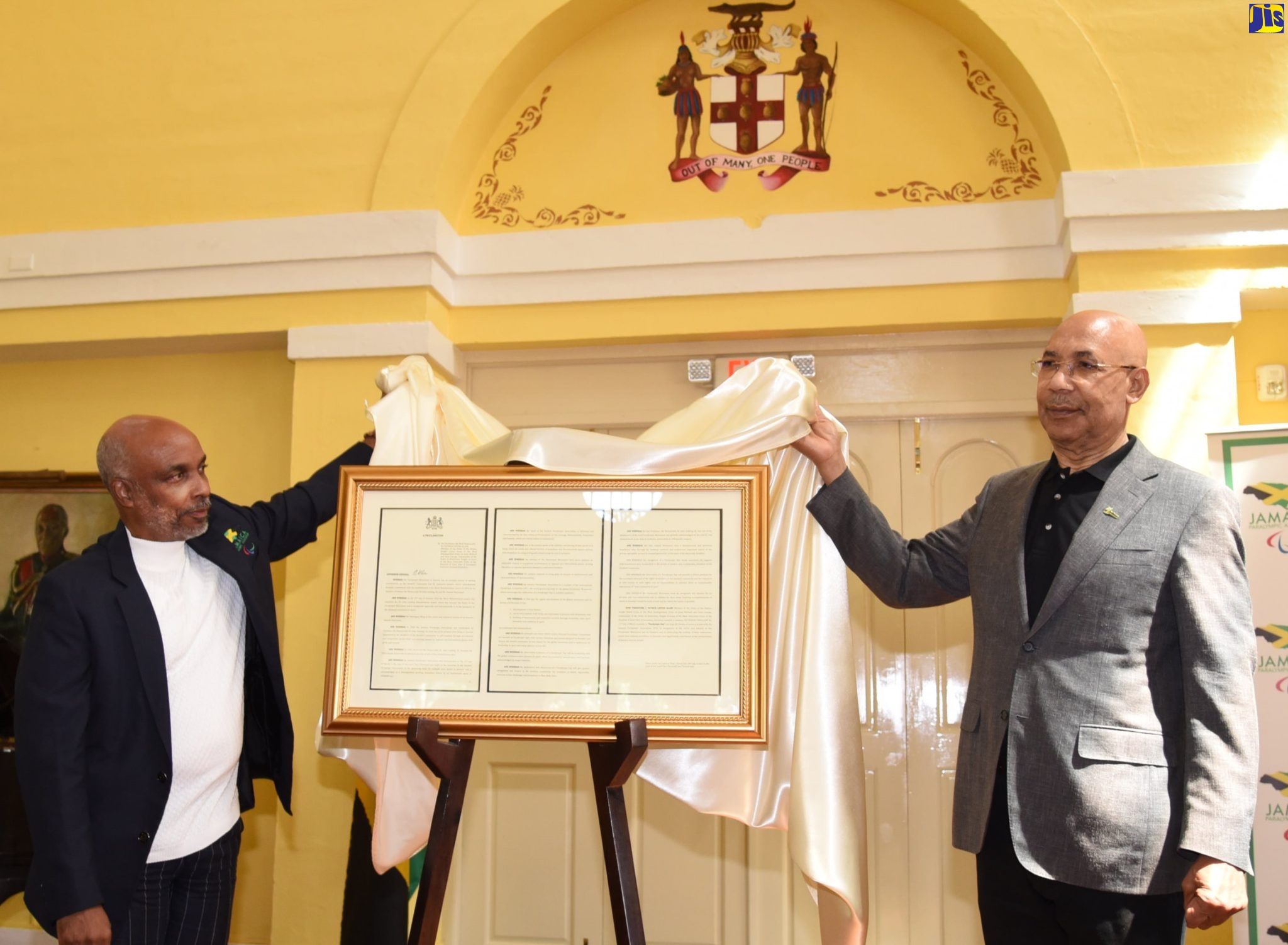 Governor-General, His Excellency the Most Hon. Sir Patrick Allen (right), and Jamaica Paralympic Association (JPA) President, Christopher Samuda, unveil the Proclamation declaring March 11 as Paralympic Day annually, during a ceremony on Friday (March 10) at King’s House, where the JPA’s ‘I’m Phenomenal’ campaign was also launched.