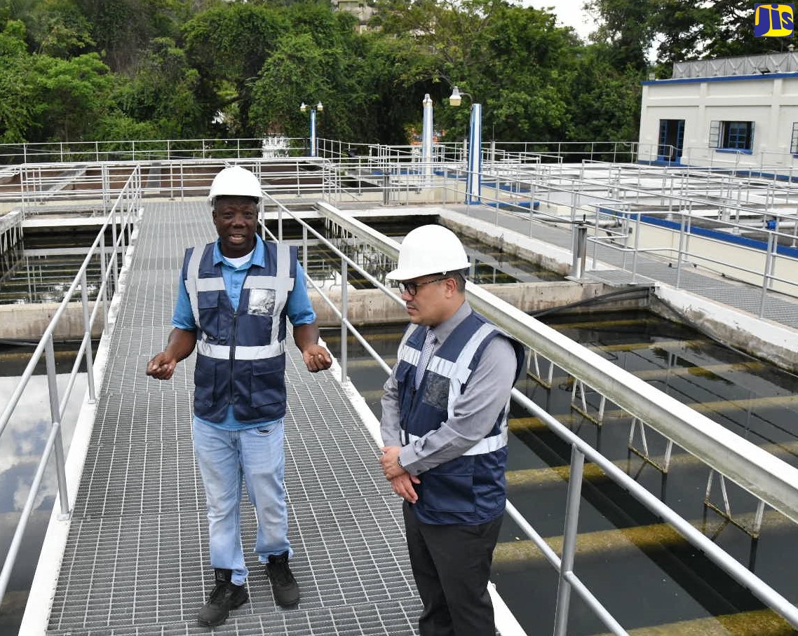 Minister Without Portfolio in the Ministry of Economic Growth and Job Creation, Senator the Hon. Matthew Samuda (right), listens as Plant Supervisor, Constant Spring Water Treatment Plant (WTP), Patrick Gordon, provides an update on the work done at the facility during a tour on Thursday (April 27). 