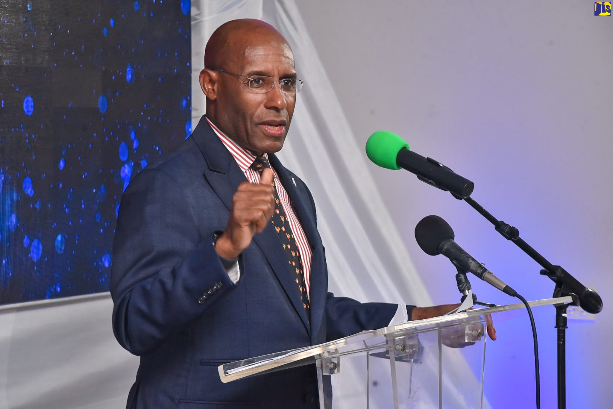 Minister of Industry, Investment and Commerce, Senator the Hon. Aubyn Hill, speaks at the Clarence Benjamin Group’s global strategic press launch, held at Jamaica Promotions Corporation (JAMPRO) offices in Kingston, on April 5.