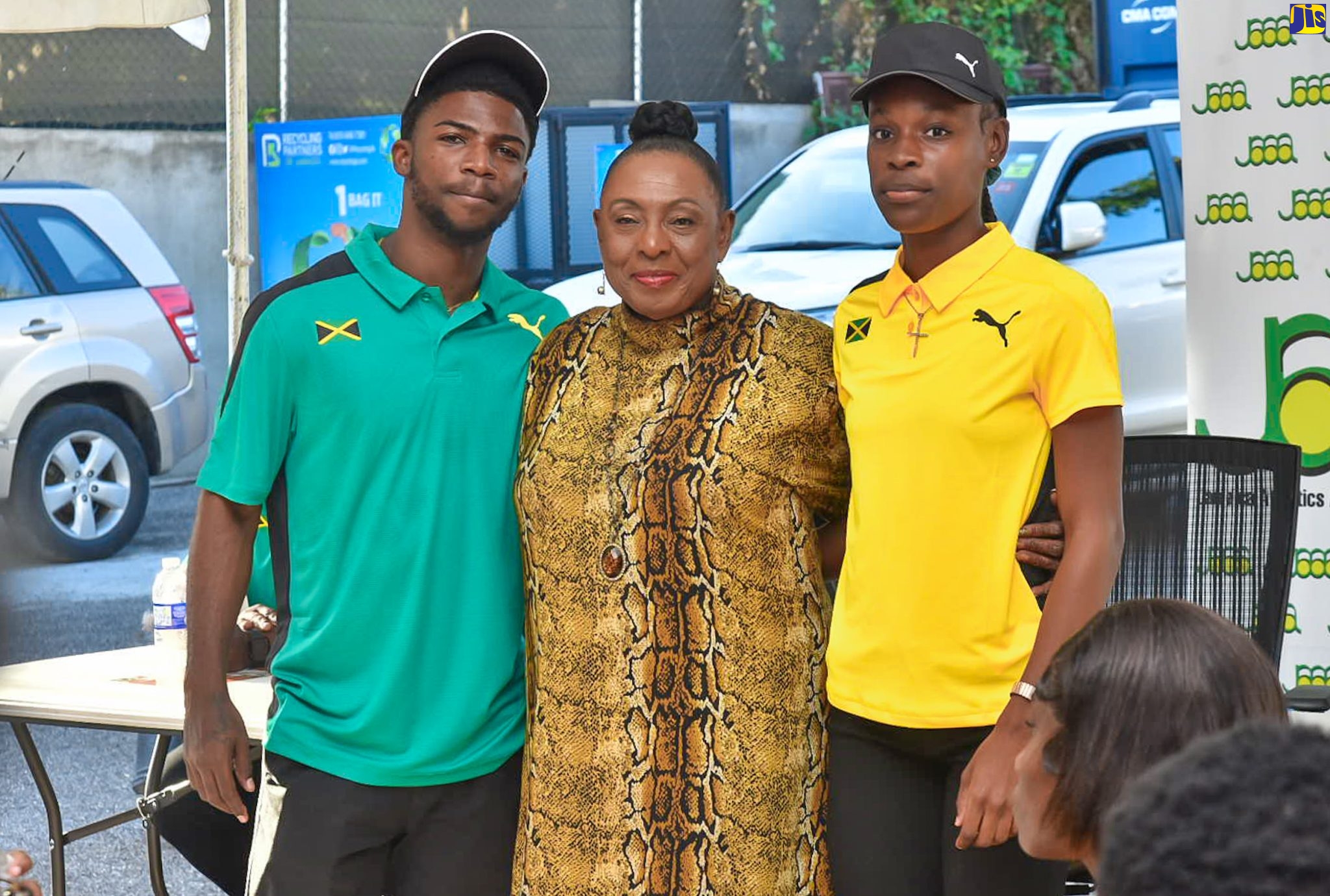 Minister of Culture, Gender, Entertainment and Sport, Hon. Olivia Grange (centre), with athletes Bouwahjgie Nkrumie (left), and Alana Reid, during a send-off ceremony held for the CARIFTA Games team, at the Jamaica Athletics Administrative Association (JAAA) offices in Kingston on April 6. The CARIFTA Games are scheduled for April 8-10 in Nassau, Bahamas.