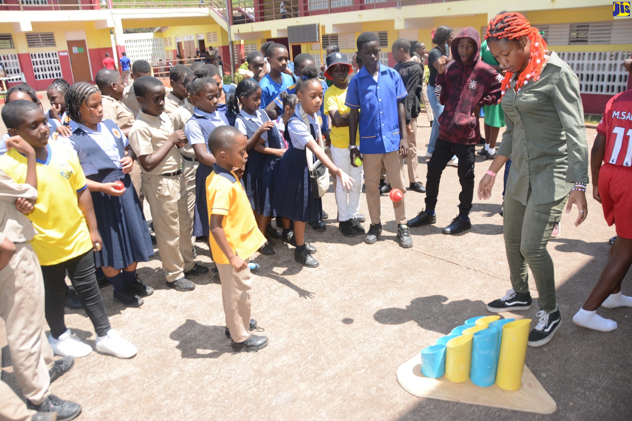Office Secretary at the Ministry of Education and Youth in St. Ann, Brianna Miller (right), oversees an activity for students during the St. Ann 4-H Clubs Achievement Day exposition at Brown’s Town Primary School in the parish, on Thursday (March 30).