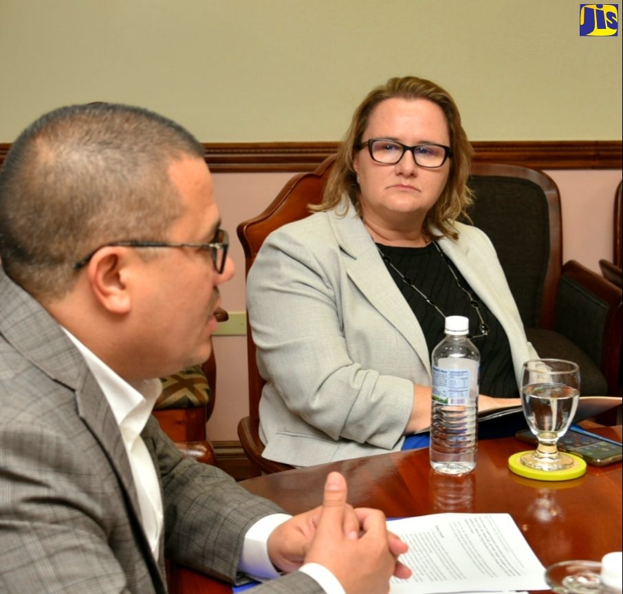 Minister Without Portfolio in the Ministry of Economic Growth and Job Creation with Responsibility for Water, Climate Change and the Environment, Senator the Hon. Mathew Samuda (left), speaking with High Commissioner of Canada in Jamaica, Her Excellency Emina Tudakovic, during a courtesy call on the Minister at the Towers on Dominica Drive in Kingston on Thursday (March 30).