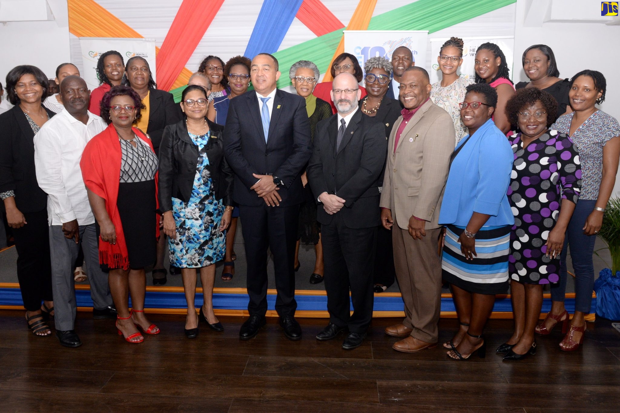 Minister of Health and Wellness, Dr. the Hon. Christopher Tufton (fifth left, front row); Chief Medical Officer, Dr Jacquiline Bisasor-McKenzie (fourth left, front row) and Pan-American Health Organization (PAHO)/World Health Organization (WHO) Representative in Jamaica, Ian Stein (fourth right, front row), are joined by officers from the Health Ministry and key stakeholders during the launch of the Problem Management Plus (PM+) initiative on March 14, at the Spanish Court Hotel in New Kingston.