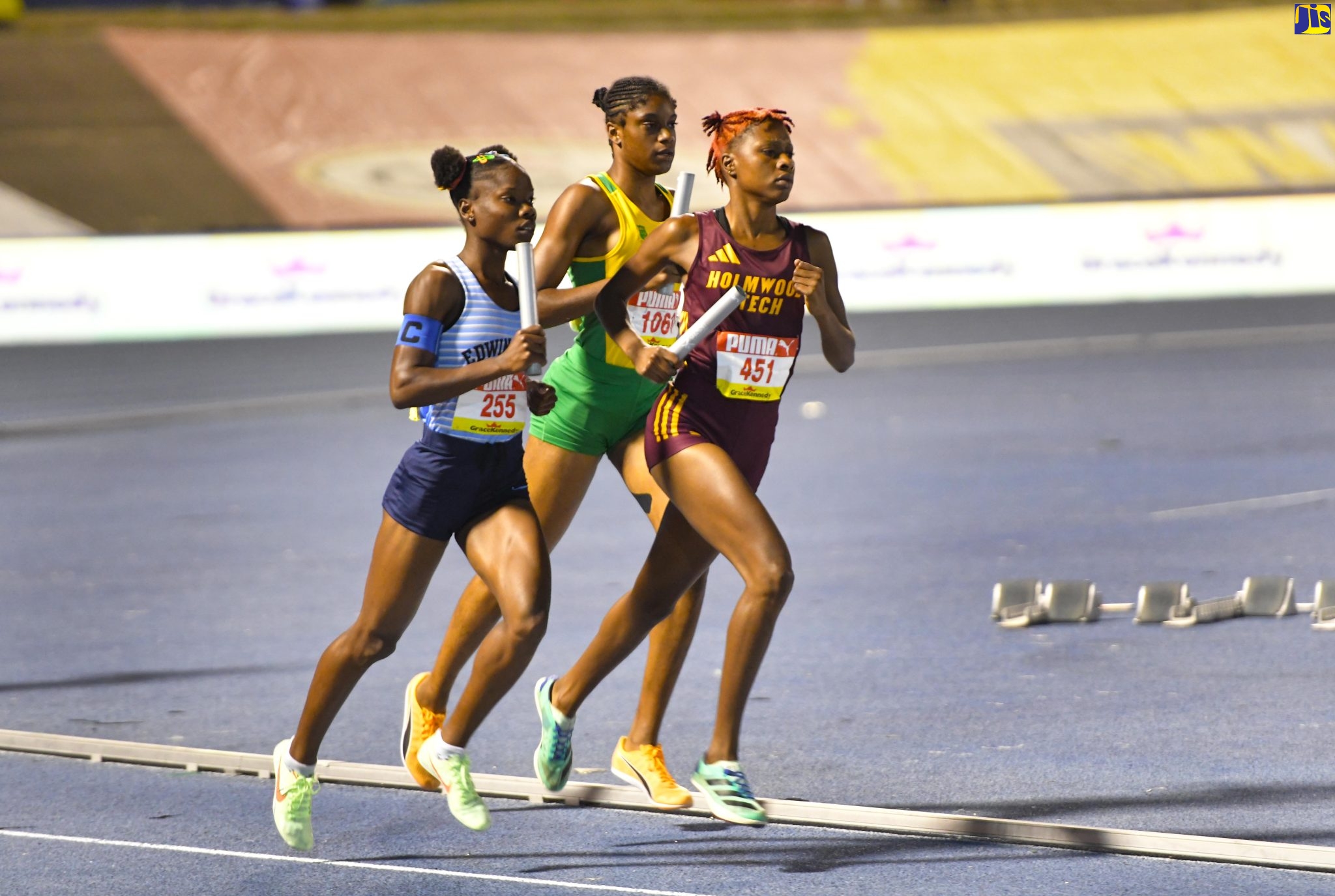 Athletes compete in the Girls 13 to 19-year-old, 1600-metre sprint open medley during the 2023 ISSA/GraceKennedy Boys and Girls’ Championships (Champs) at the National Stadium on April 1. 