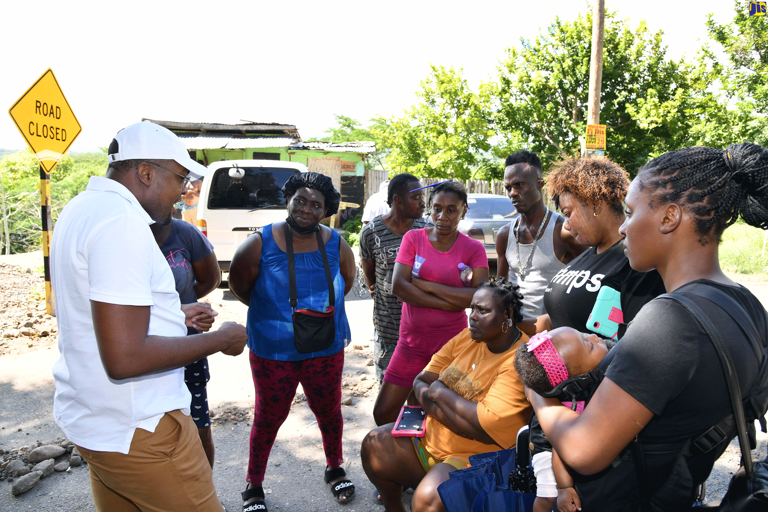 Minister without Portfolio in the Office of the Prime Minister and Member of Parliament for Clarendon North Central, Hon. Robert Morgan, addresses residents of the Suttons community in the parish, during a visit to the area on Friday (April 28).
