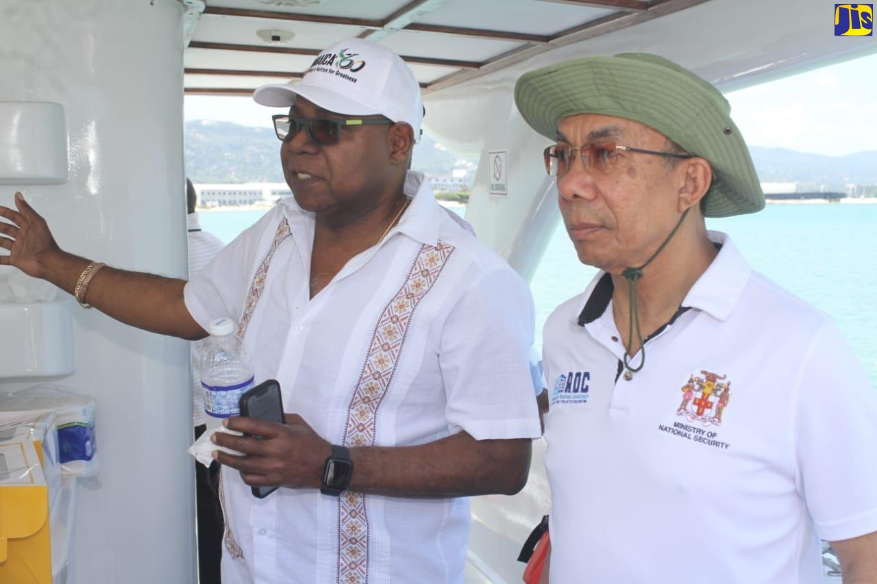 Tourism Minister, Hon. Edmund Bartlett (left), converses with Deputy Prime Minister and Minister of National Security, Hon. Dr. Horace Chang, on arrival at Pier One Restaurant in Montego Bay, St. James, for a stakeholder consultation on March 30.