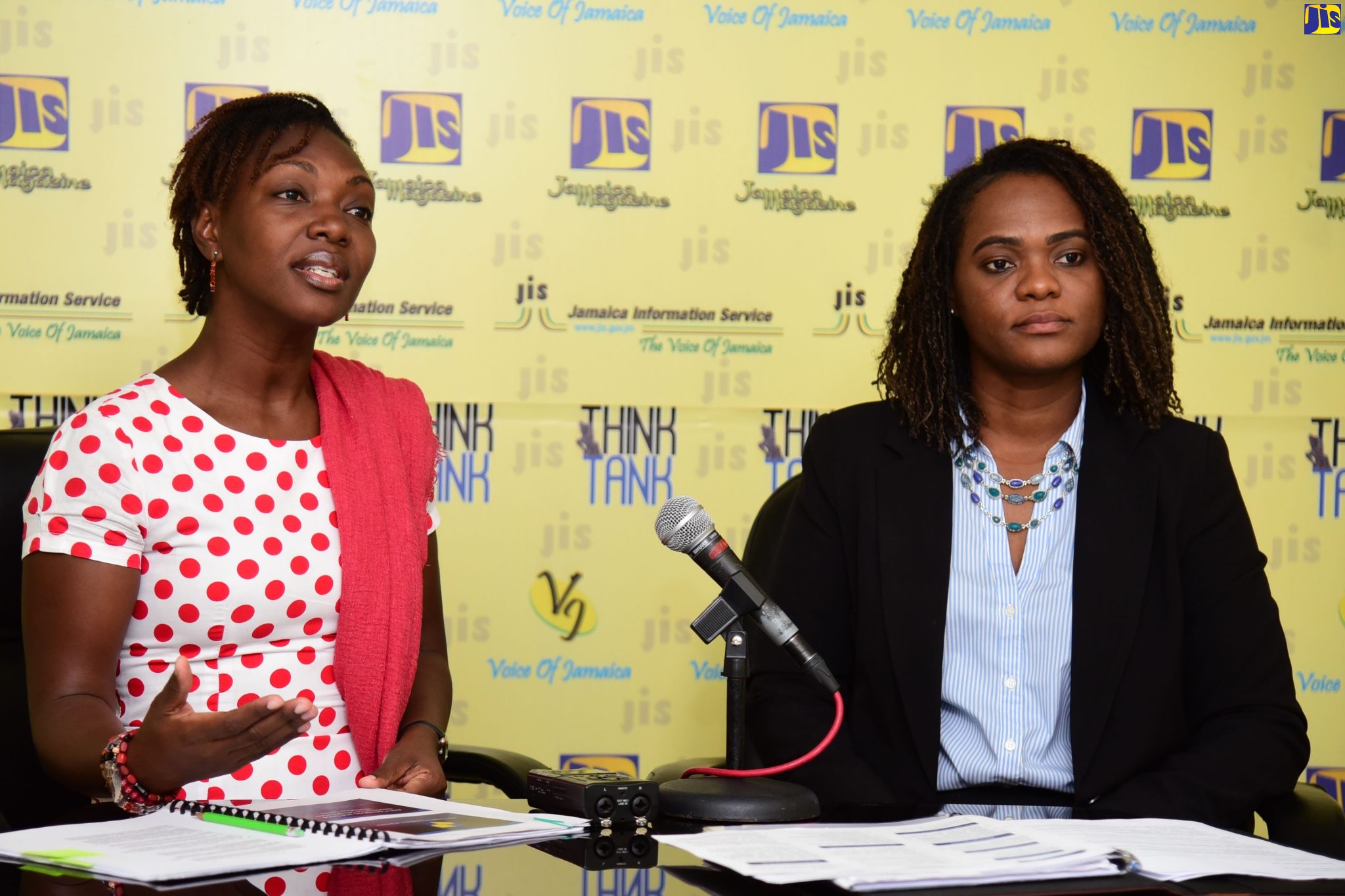 Senior Complaints Review Officer, Integrity Commission (IC), Alecia Darby (left), makes a point while speaking during a recent Jamaica Information Service (JIS) ‘Think Tank’ at the Agency’s head office in Kingston. She is joined by Senior Protected Disclosures Officer in the Commission’s Information and Complaints Division, Tanesha Fagan.