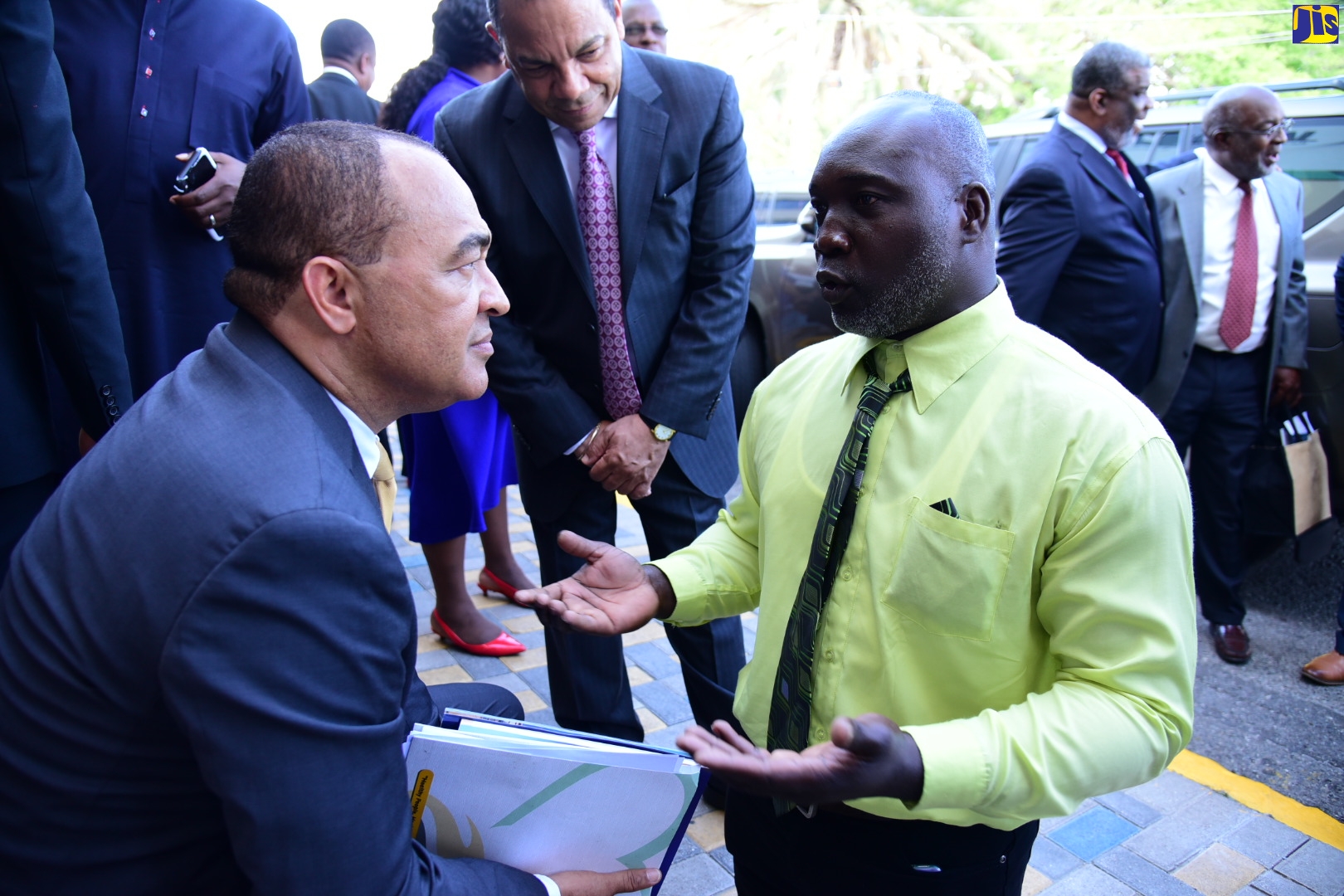 Minister of Health and Wellness, Dr. the Hon. Christopher Tufton (left), speaks with double amputee and pineapple farmer from Clarendon, Andrew Nelson (right), following the sitting of the House of Representatives on May 3. Mr. Nelson is the first person with a disability to be measured to receive prostheses under the ‘A Prosthetic Partnership Programme for Persons with Disabilities in Jamaica’. The Ministry of Health and Wellness is partnering with the Jamaica Council for Persons with Disabilities (JCPD) on the initiative, through which $50 million will be allocated to provide qualified persons with properly fitted prostheses, enabling them to return to optimal productivity and social participation.