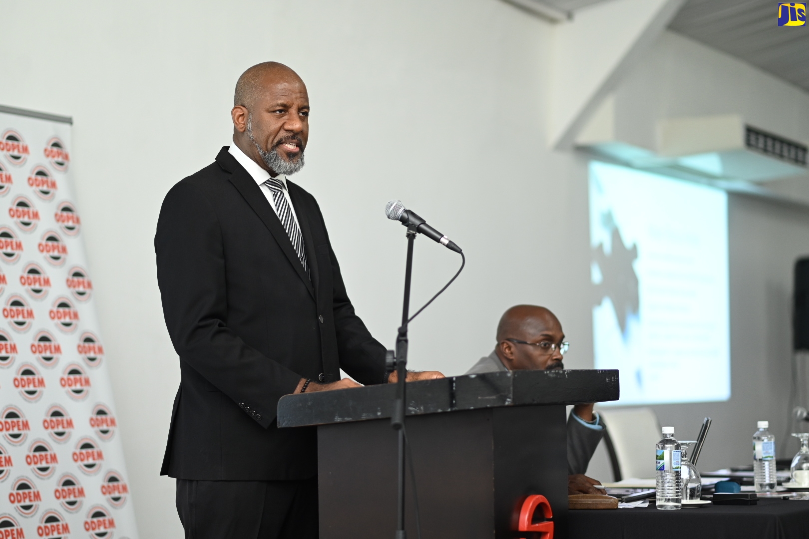 Chairman of the Recovery Planning Committee, National Disaster Risk Management Council and Director General of the Planning Institute of Jamaica (PIOJ), Dr. Wayne Henry, addresses the working session of the National Disaster Risk Management Council meeting held at the Spanish Court Hotel in New Kingston on May 25.