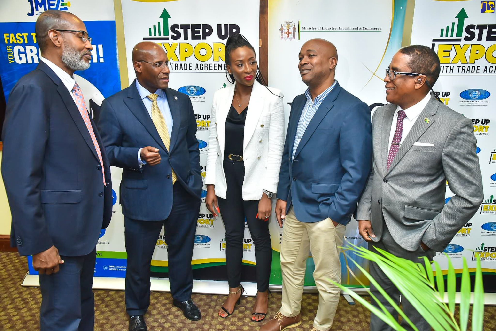 Industry, Investment, and Commerce Minister, Senator the Hon. Aubyn Hill  (second left) listens to a comment from Group Export Manager, Wisynco Group Limited, Stephen Dawkins (second right), during the ‘Step Up Export with Trade Agreements’ seminar held on Tuesday (May 16) at the University of the West Indies (UWI) Regional Headquarters in Kingston. Others sharing in the conversation (from left) are Trade Administrator/Chief Executive Officer, The Trade Board Limited, Dr.  Hugh Blake; Chair, Trade Facilitation Board Sub-Committee of the Trade Board Limited, Daenia Ashpole and Minister of State in the Ministry, Hon. Norman Dunn. 