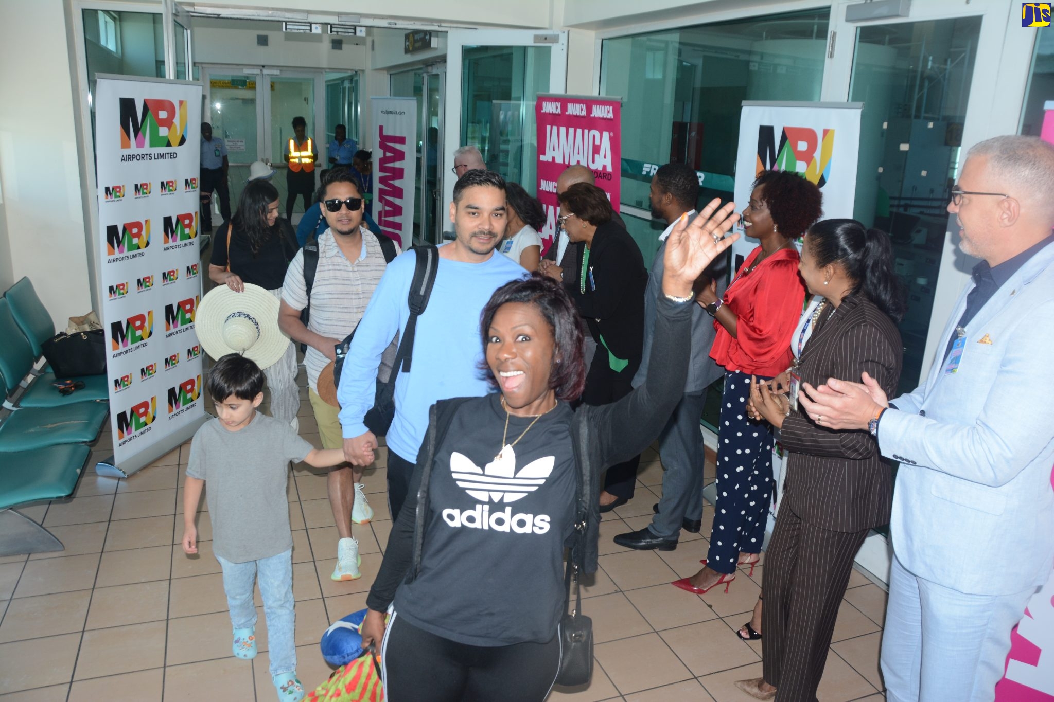 Passengers arriving at the Sangster International Airport in Montego Bay, St. James, May 22, aboard Frontier Airlines inaugural flight from Dallas-Fort Worth International Airport in Dallas, Texas, USA. They are being greeted by executive members of MBJ Limited, among other tourism stakeholders. 
